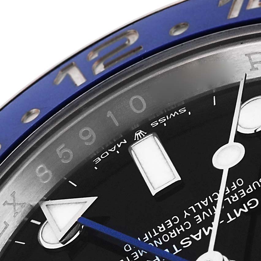 The image shows a close-up of the dial and bezel of a Rolex GMT-Master 126710 Men's Stainless Steel Black Dial 126710 Men's Stainless Steel Black Dial watch, focusing on the hour indices, hands, and part of the blue bezel.
