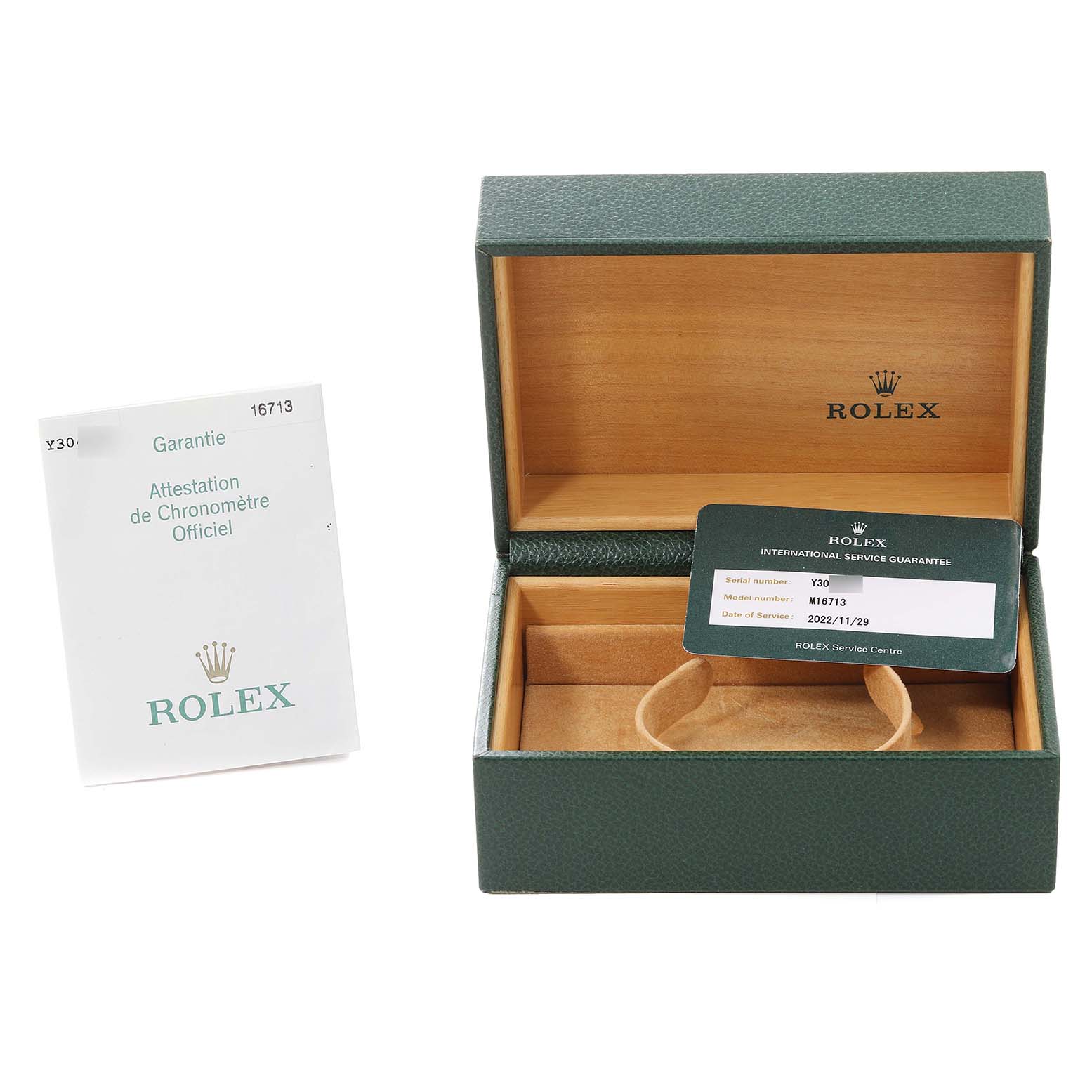 This image shows an open green Rolex box with documents and a holder for the Rolex GMT-Master 16713 Men's Steel and Gold (two tone) Brown Dial 16713 Men's Steel and Gold (two tone) Brown Dial watch.