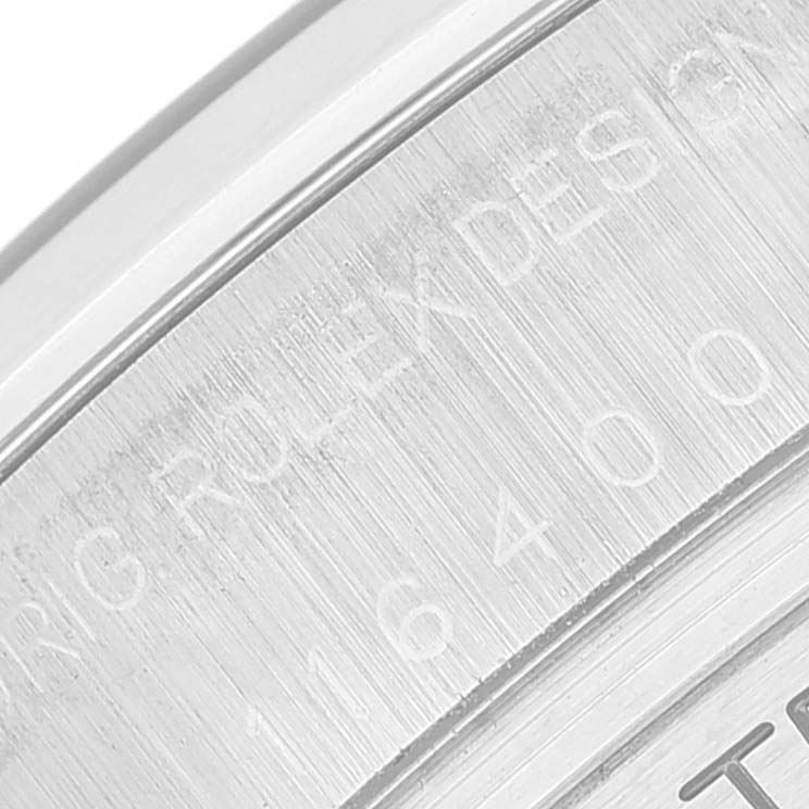 This image shows a close-up of the engraved text on the back of a Rolex Milgauss 116400 Men's Stainless Steel Black Dial 116400 Men's Stainless Steel Black Dial watch.