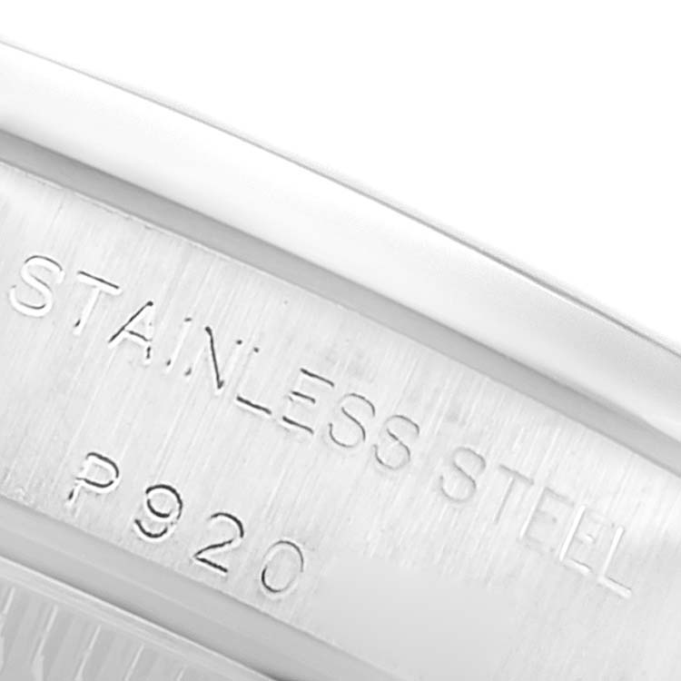 This is a close-up view of the case back of the Rolex Oyster Perpetual 76080 Women's Stainless Steel Black Dial 76080 Women's Stainless Steel Black Dial watch, showing the "STAINLESS STEEL" engraving.