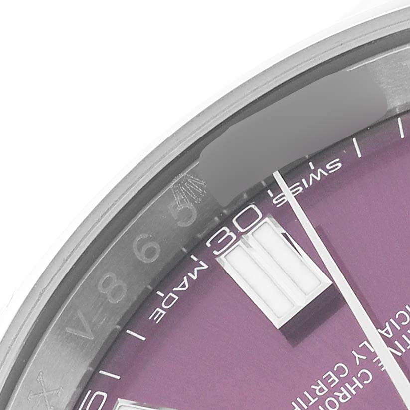 This image shows a close-up of the dial and bezel of a Rolex Oyster Perpetual 116000 Men's Stainless Steel Purple Dial 116000 Men's Stainless Steel Purple Dial watch.