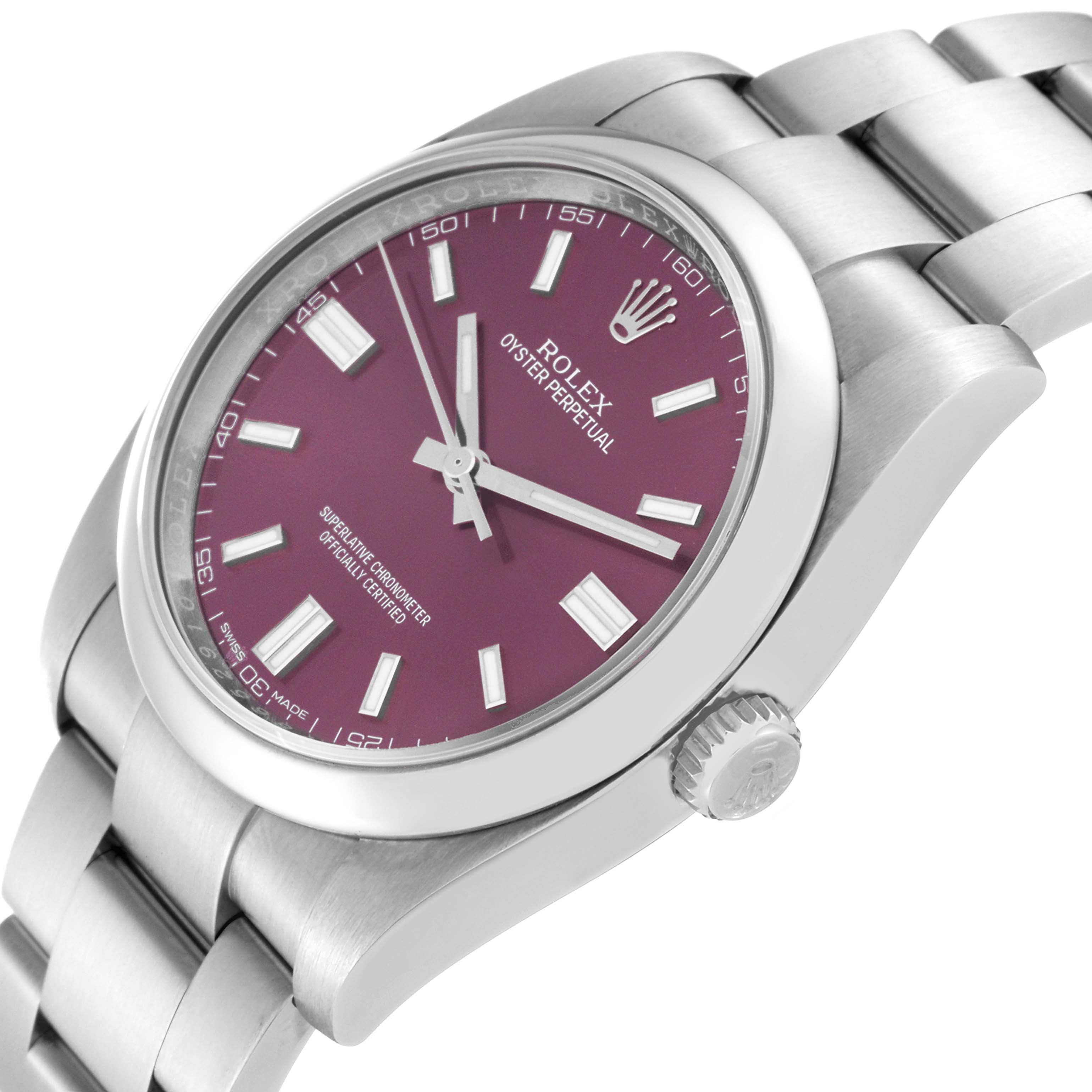 The Rolex Oyster Perpetual 116000 Men's Stainless Steel Purple Dial 116000 Men's Stainless Steel Purple Dial watch is shown at an angled close-up, highlighting its purple dial, crown, and part of the bracelet.