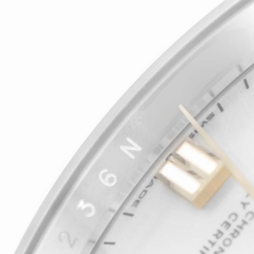The image shows a close-up of a Rolex Oyster Perpetual 126000 Men's Stainless Steel Silver Dial 126000 Men's Stainless Steel Silver Dial watch's dial and hands at an angled view, highlighting the numerals and markers.