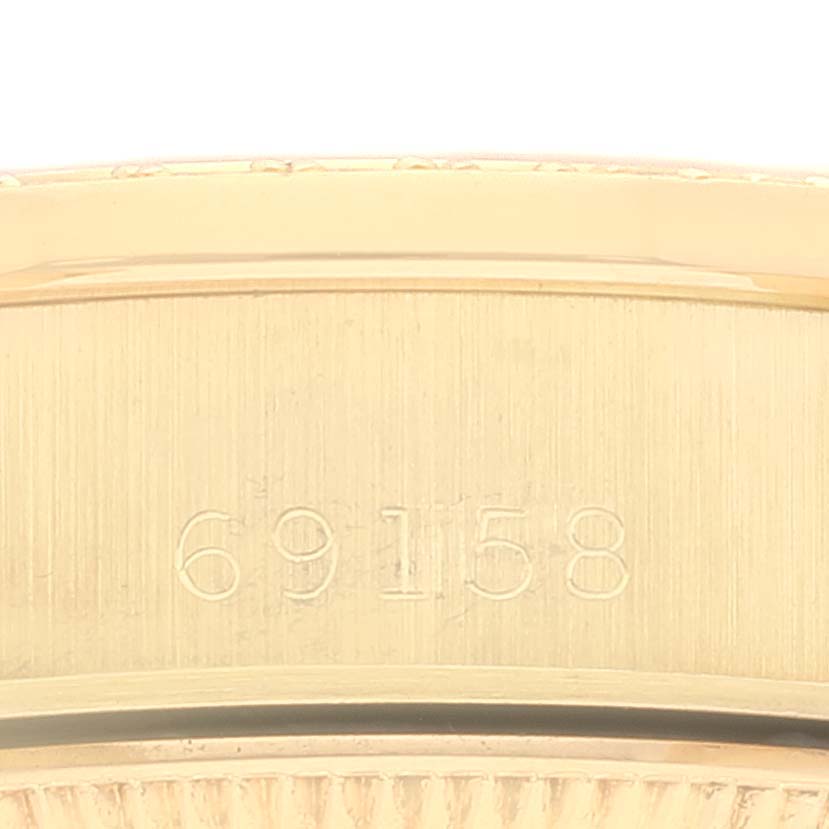 The image shows a close-up view of the case back with the engraved model number of a Rolex President 69158 Women
s Yellow Gold Champagne Dial 69158 Women
s Yellow Gold Champagne Dial watch.
