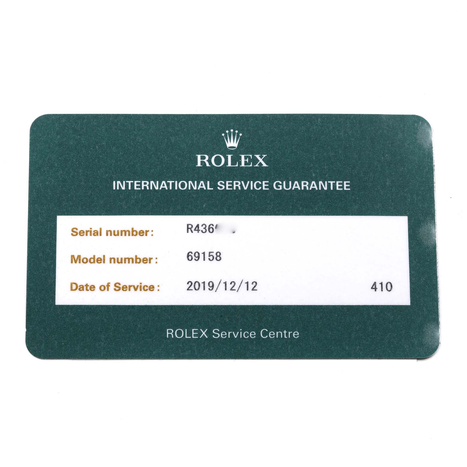 The image shows a Rolex International Service Guarantee card for the Rolex President 69158 Women
s Yellow Gold Champagne Dial 69158 Women
s Yellow Gold Champagne Dial model, number 69158.