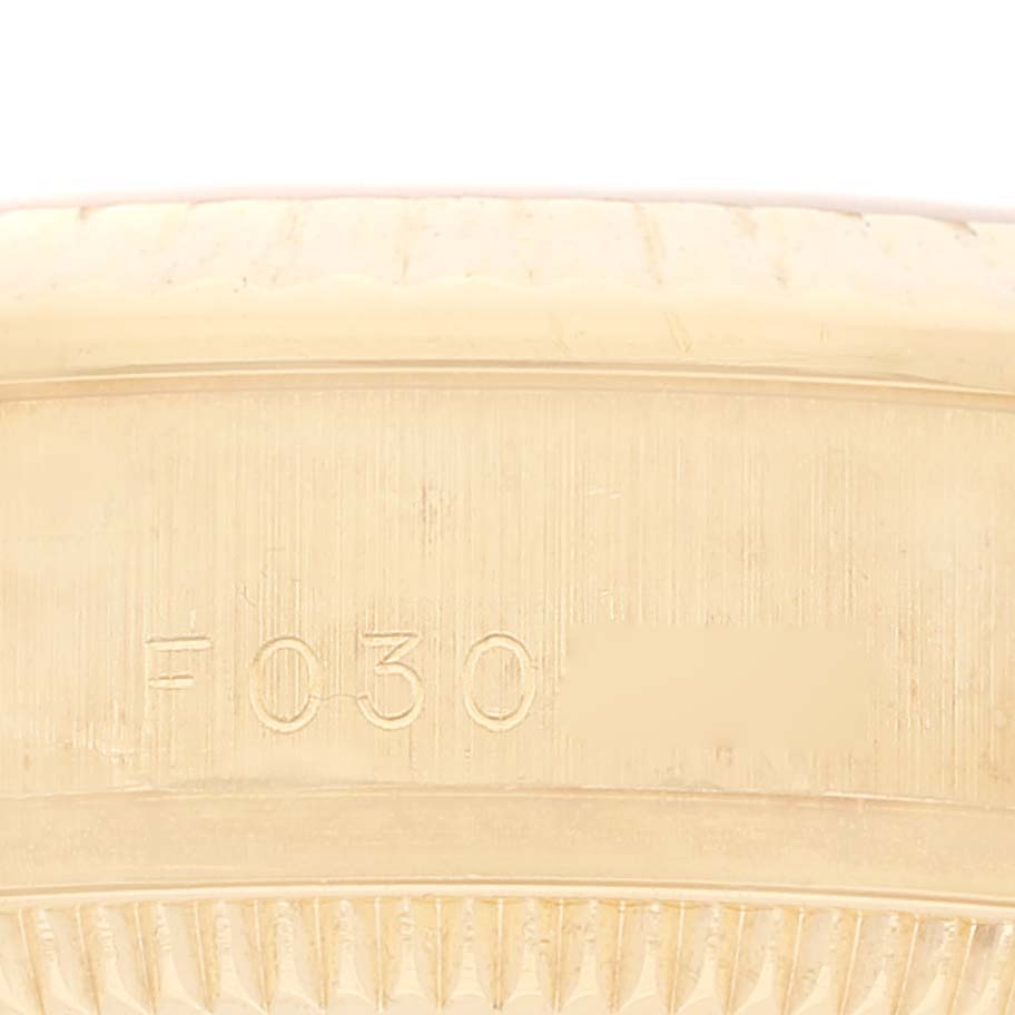 The image shows a close-up of the side engraving on the bezel of a Rolex President 178278 Women
s Yellow Gold Champagne Dial 178278 Women
s Yellow Gold Champagne Dial model watch.