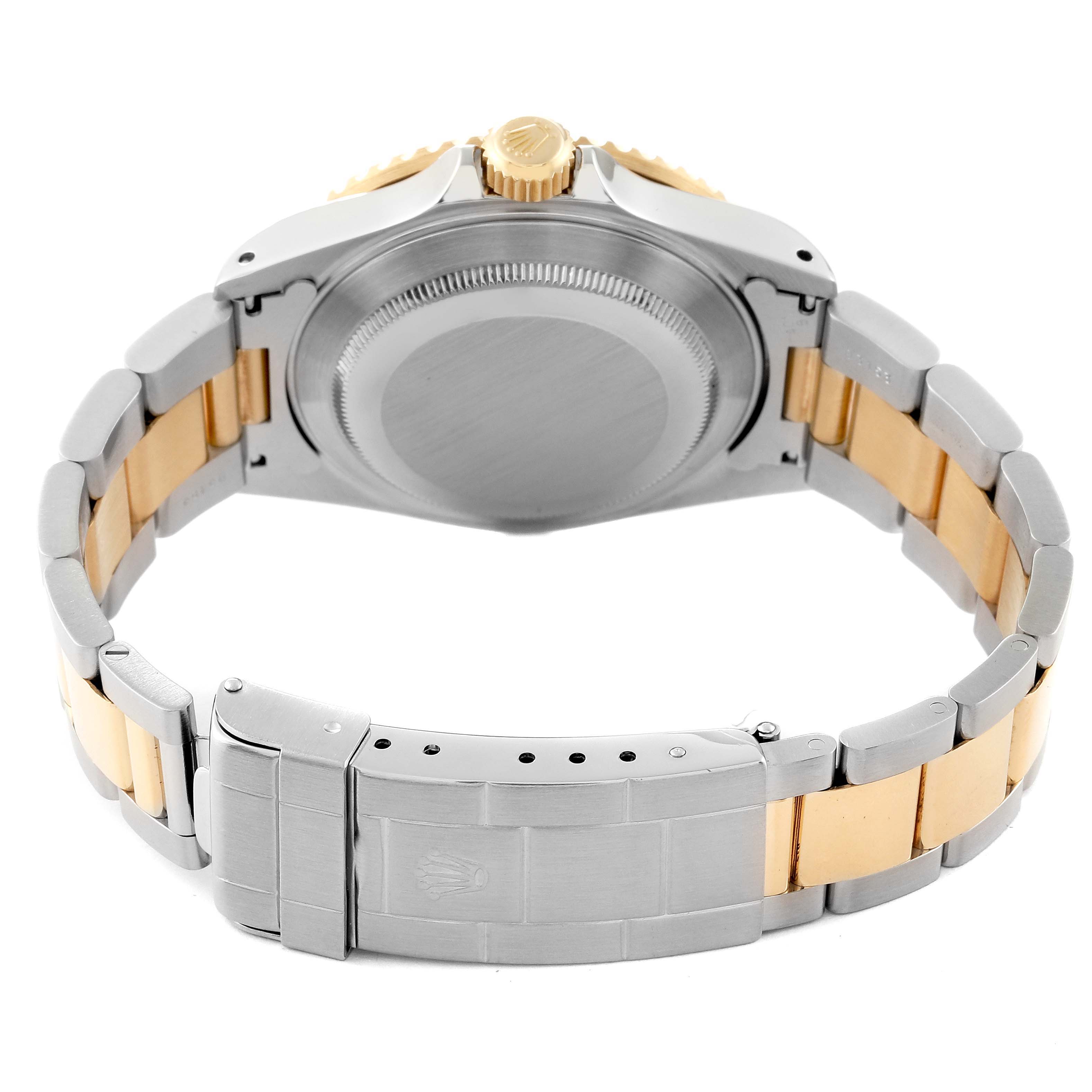 This image shows the back view of a Rolex Submariner 16613 Men's Steel and Gold (two tone) Blue Dial 16613 Men's Steel and Gold (two tone) Blue Dial watch, featuring the case back, crown, and two-tone bracelet with clasp.