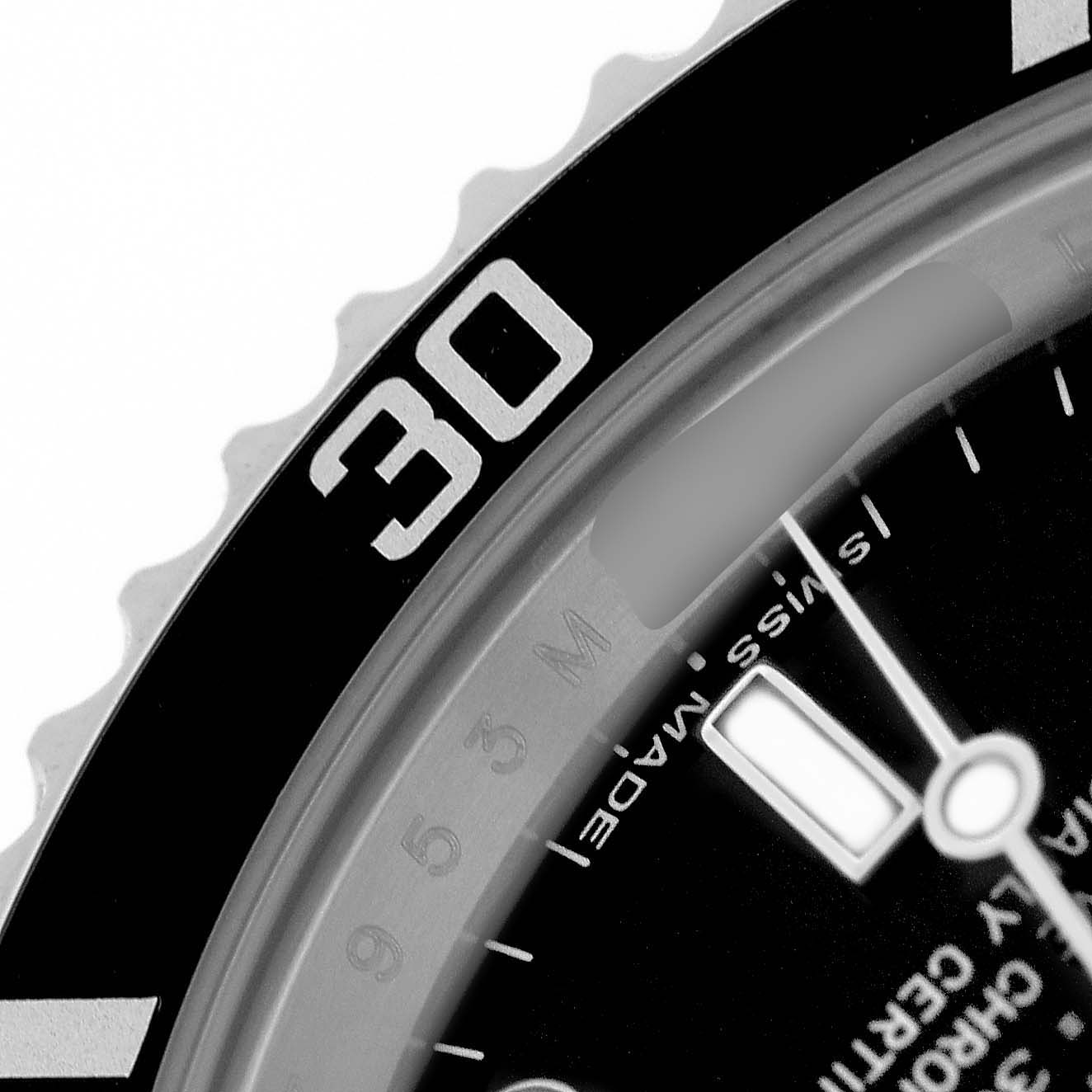 The image shows a close-up of the bezel and part of the dial of a Rolex Submariner 14060M Men's Stainless Steel Black Dial.