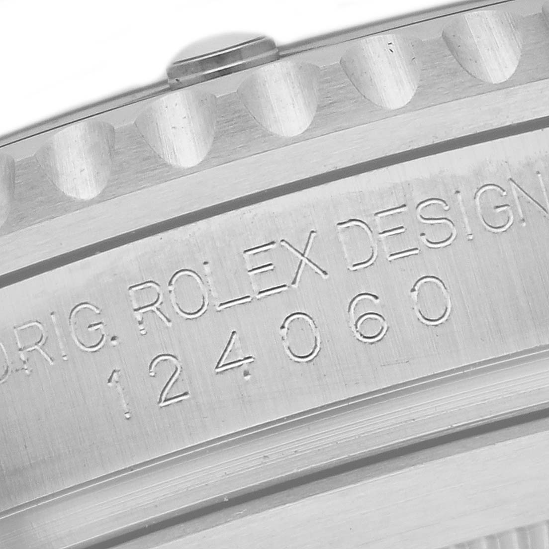 The image shows a close-up of the engraving on the bezel and case of a Rolex Submariner 124060 Men
s Stainless Steel Black Dial 124060 Men
s Stainless Steel Black Dial watch.