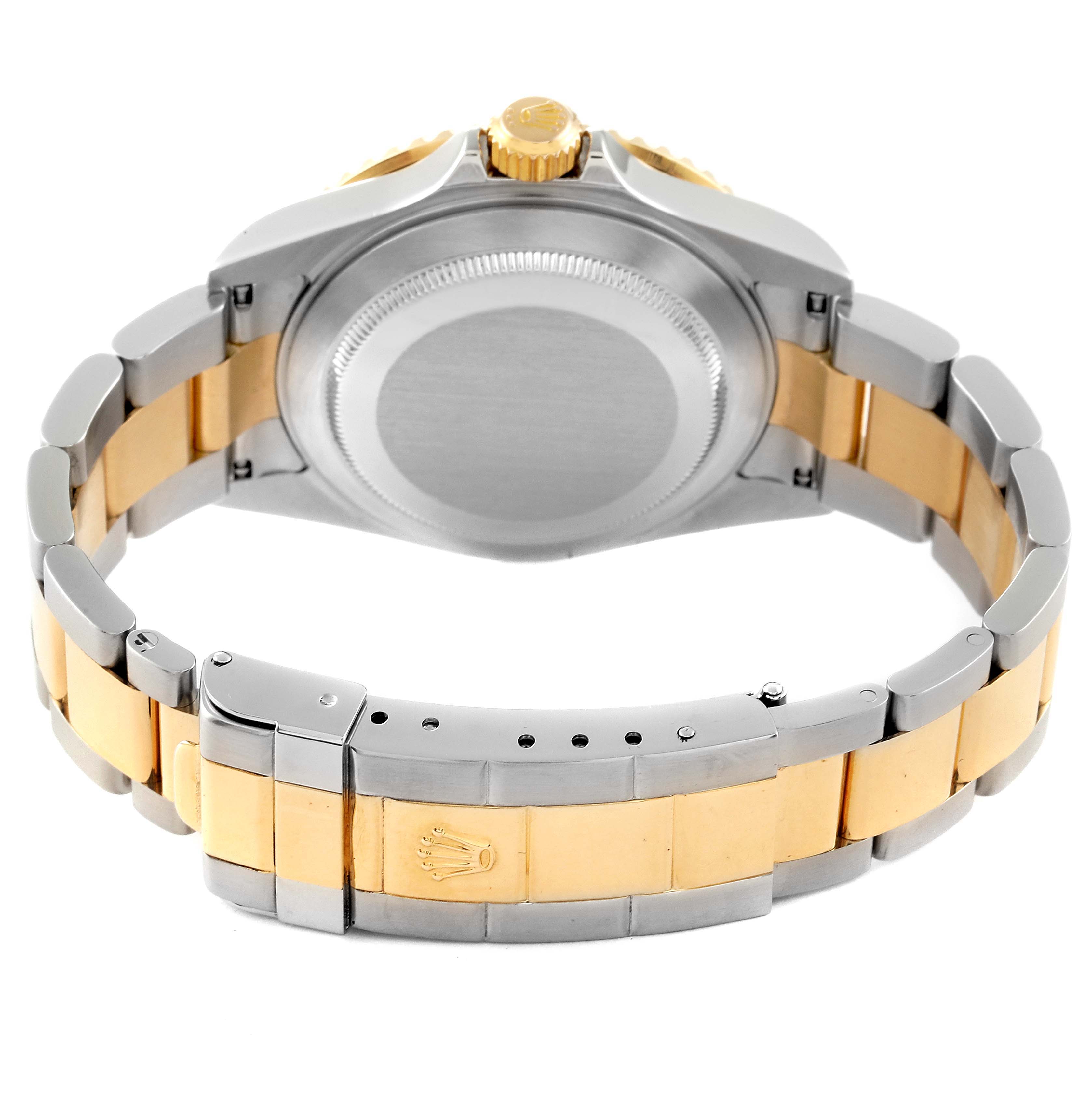 The image shows a rear angle of the Rolex Submariner 16613 Men's Steel and Gold (two tone) Champagne Dial 16613 Men's Steel and Gold (two tone) Champagne Dial watch, highlighting its gold and silver bracelet and closed case back.
