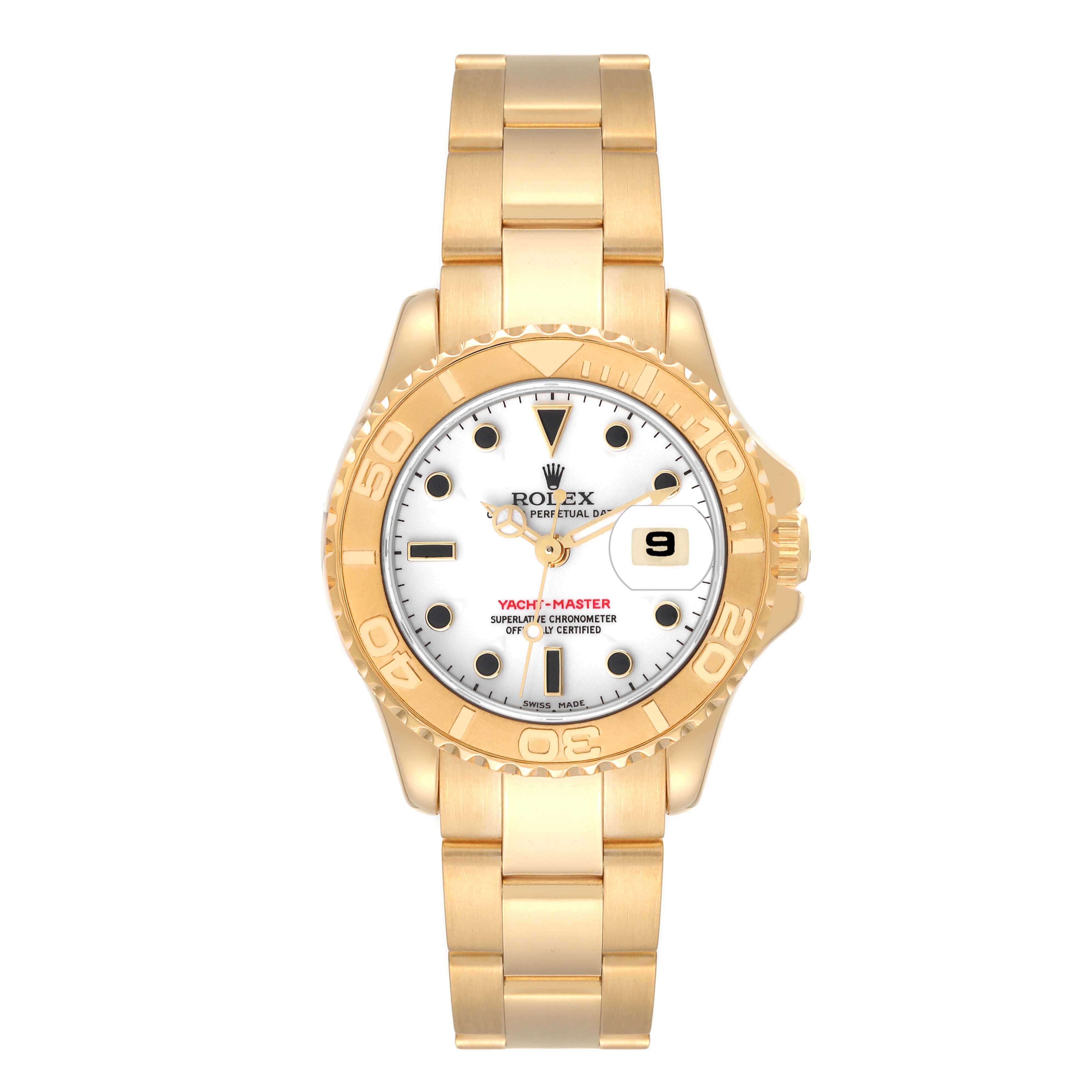 The image shows a Rolex Yacht-Master 69628 Women's Yellow Gold White Dial 69628 Women's Yellow Gold White Dial watch, photographed from a top-down angle, displaying its face, bezel, and bracelet.