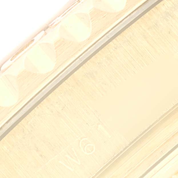 This image shows an up-close side view of the bezel and case of a Rolex Yacht-Master 69628 Women's Yellow Gold White Dial 69628 Women's Yellow Gold White Dial watch.