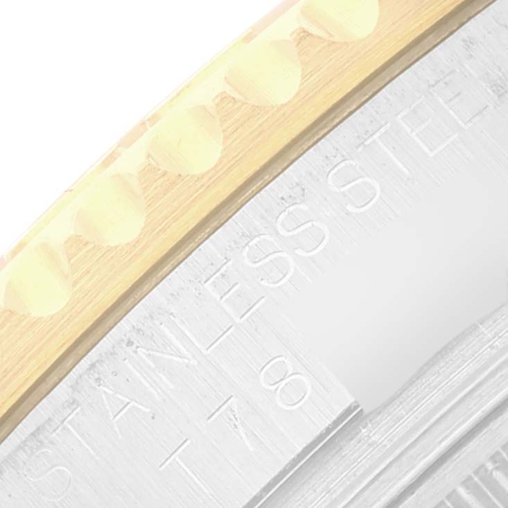 The image shows a close-up of the bezel and part of the case of the Rolex Yacht-Master 68623 Men
s Steel and Gold (two tone) White Dial 68623 Men
s Steel and Gold (two tone) White Dial watch.