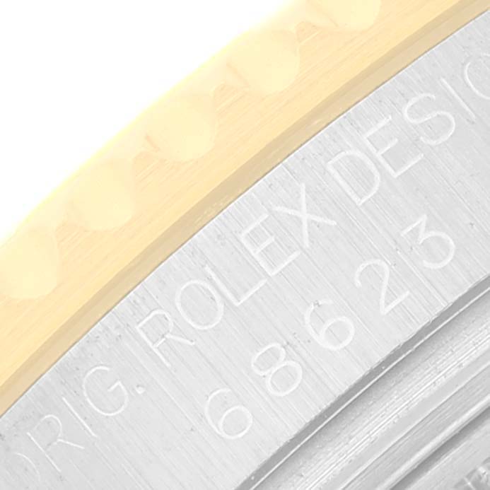 The image shows a close-up angle of the bezel and case edge, with "ORIG. ROLEX DESIGN" engraved on the Rolex Yacht-Master 68623 Men
s Steel and Gold (two tone) White Dial 68623 Men
s Steel and Gold (two tone) White Dial watch.