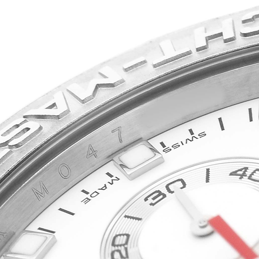 The image shows a close-up of the bezel and part of the dial of a Rolex Yacht-Master 116689 Men's White Gold White Dial watch.