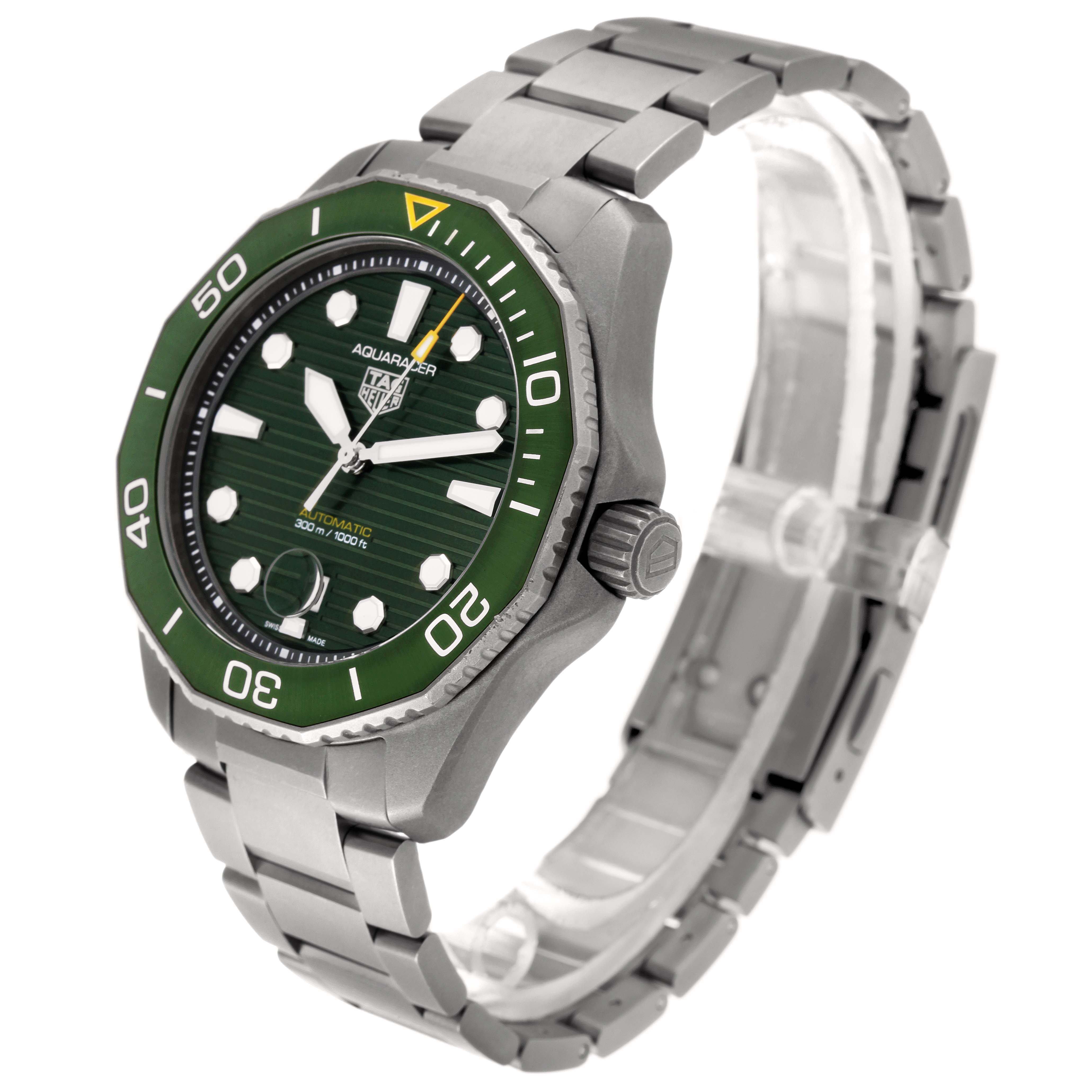 The image showcases a Tag Heuer Aquaracer WBP208B.BF0631 Men's Titanium Green Dial WBP208B.BF0631 Men's Titanium Green Dial watch from a three-quarter view, highlighting its green bezel, dial, and stainless steel bracelet.