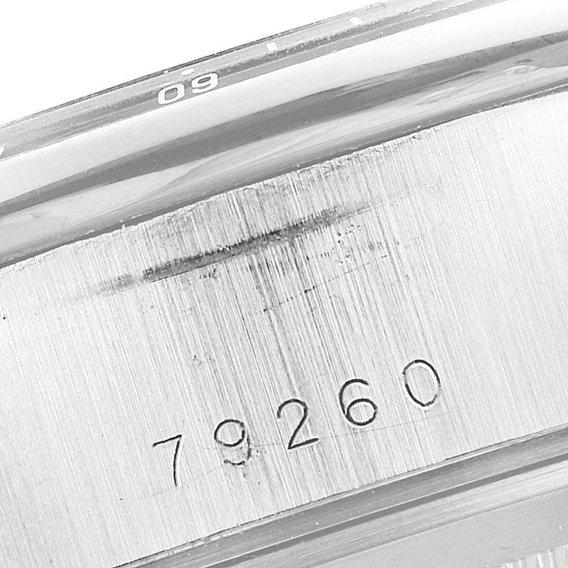 This close-up image shows the engraved serial number "79260" on the case of the Tudor Tiger 79260 Men's Stainless Steel Yellow Dial 79260 Men's Stainless Steel Yellow Dial model watch.
