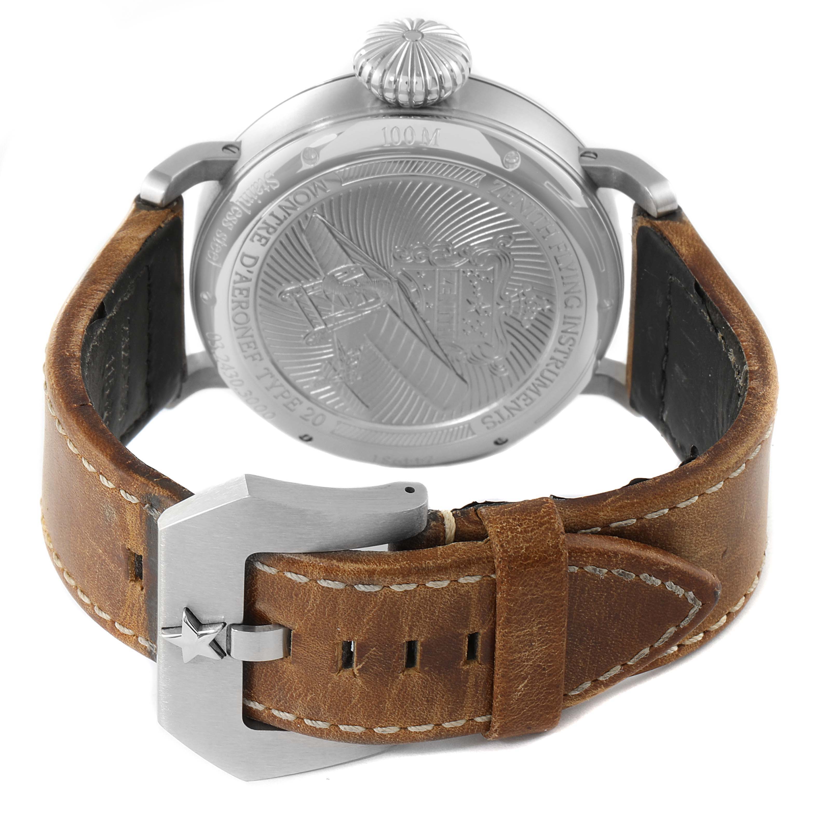 The image shows the back case and leather strap of a Zenith Pilot 03.2430.3000/21C738 Men's Stainless Steel Black Dial 03.2430.3000/21C738 Men's Stainless Steel Black Dial watch, highlighting its engraved design and metal clasp with a star.