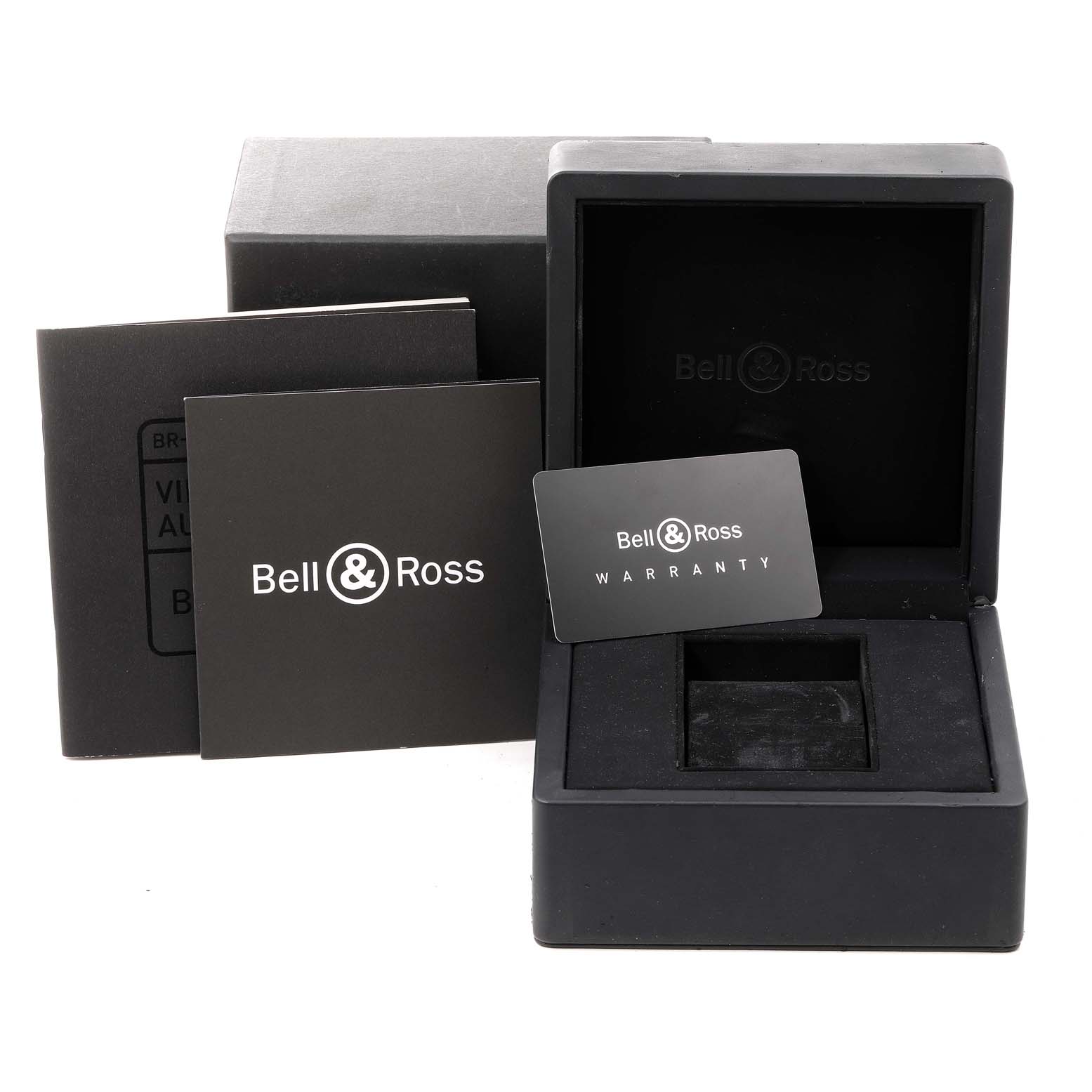 This image shows the packaging, warranty card, and booklet for a Bell & Ross Heritage BRV292-BU-G-ST/SCA Men's Stainless Steel Blue Dial BRV292-BU-G-ST/SCA Men's Stainless Steel Blue Dial model watch.