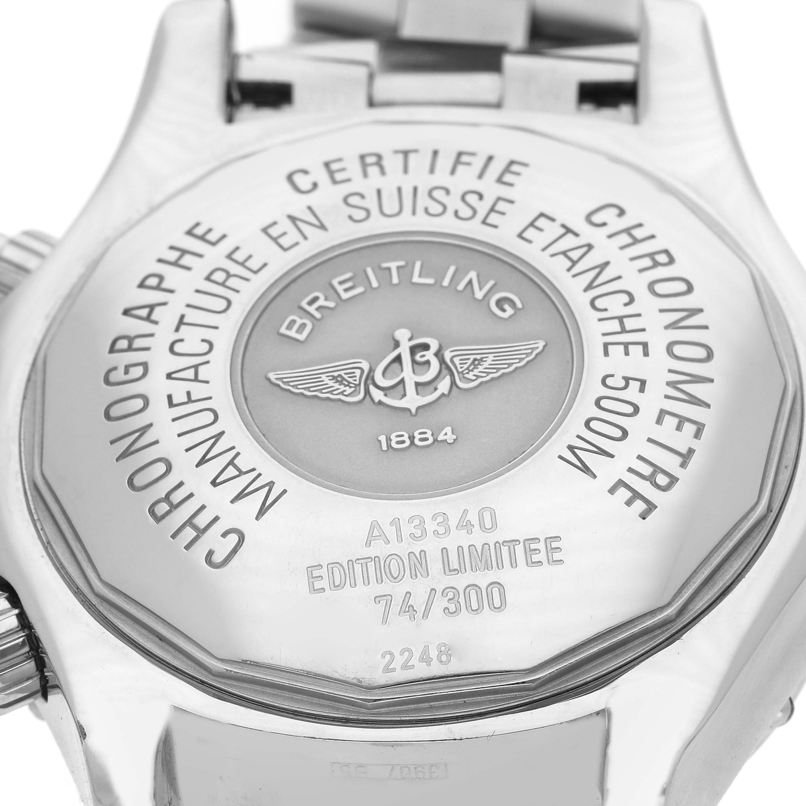 The image shows the back case of a Breitling Superocean A13340 Men's Stainless Steel Grey Dial A13340 Men's Stainless Steel Grey Dial watch, displaying engravings and the brand logo.
