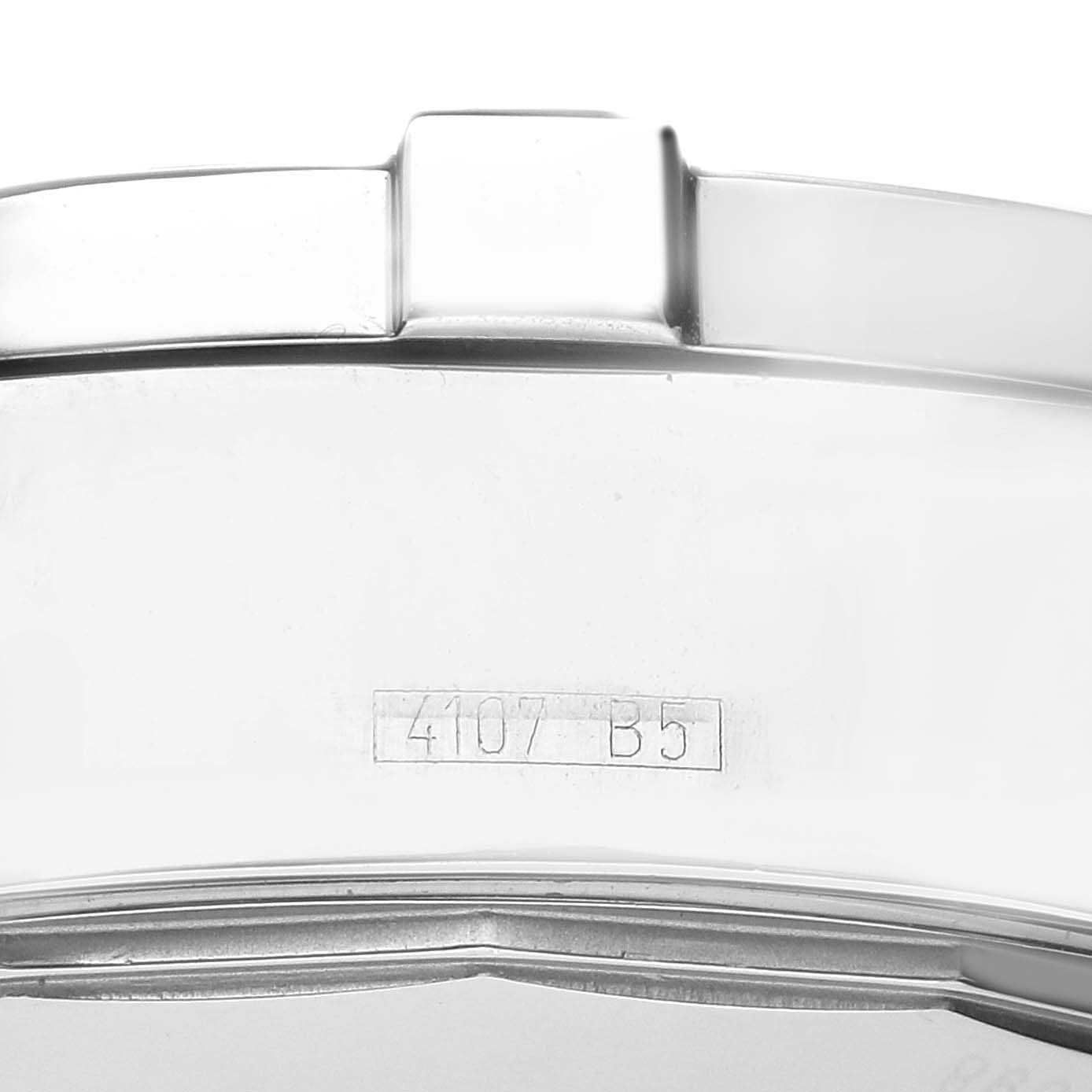 The image shows a side view of the case of a Breitling Superocean A13340 Men's Stainless Steel Grey Dial A13340 Men's Stainless Steel Grey Dial, focusing on its metal surface and serial number.