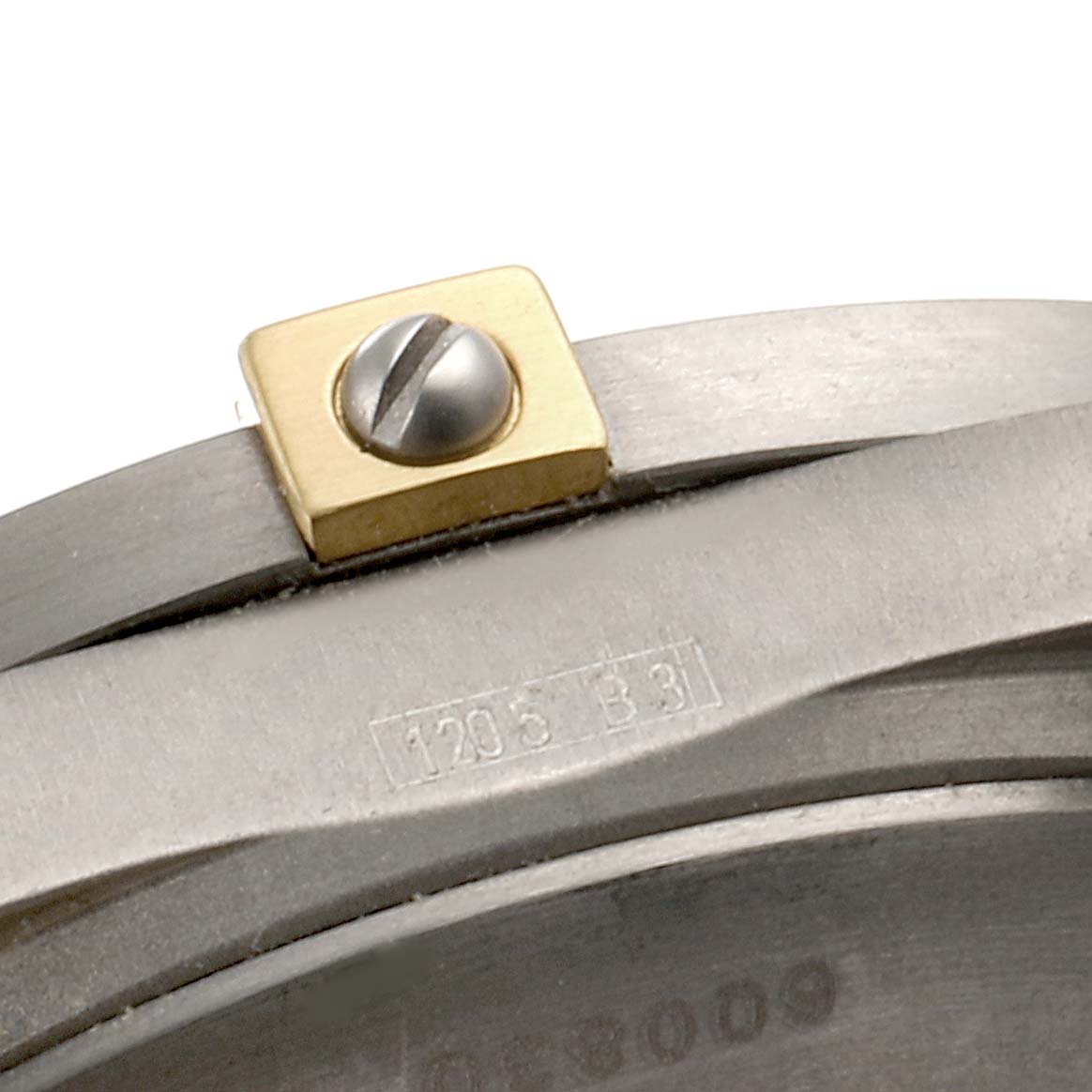 The image shows a close-up of the bezel and case edge of a Breitling Professional Series F75362 Men's Titanium Grey Dial F75362 Men's Titanium Grey Dial watch, highlighting a screw and engraved numbers.