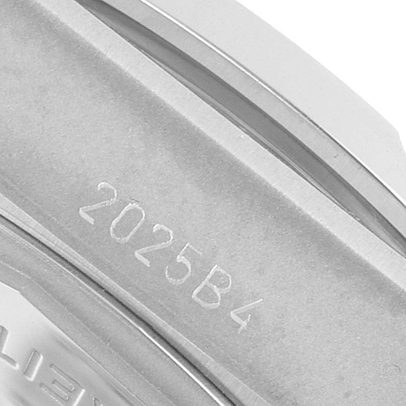 The image shows a close-up of the side of a Breitling Chronomat A32398 Men's Stainless Steel White Dial watch, focusing on the engraved reference number.