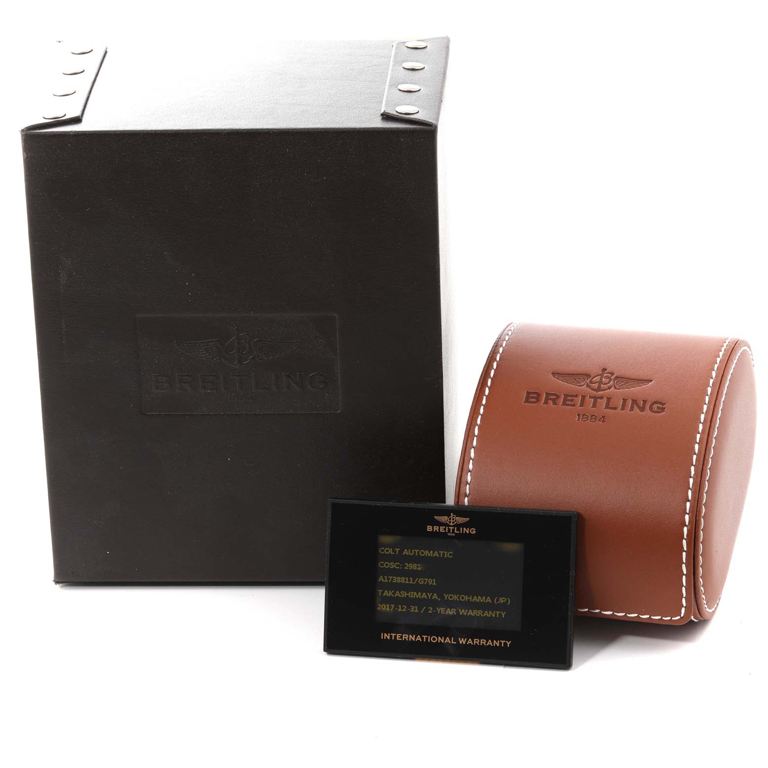 This image shows the Breitling Colt A1738811/G791 Men
s Stainless Steel White Dial A1738811/G791 Men
s Stainless Steel White Dial watch box, leather case, and an international warranty card.