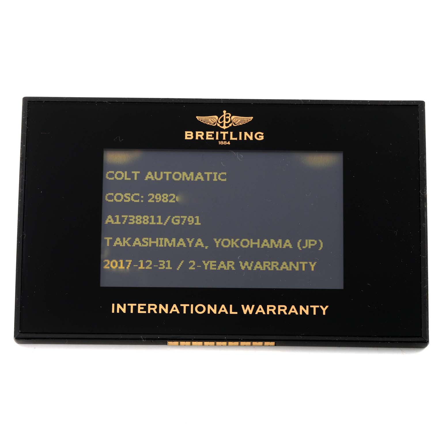 This is the international warranty card of the Colt model by Breitling, shown from a front angle.