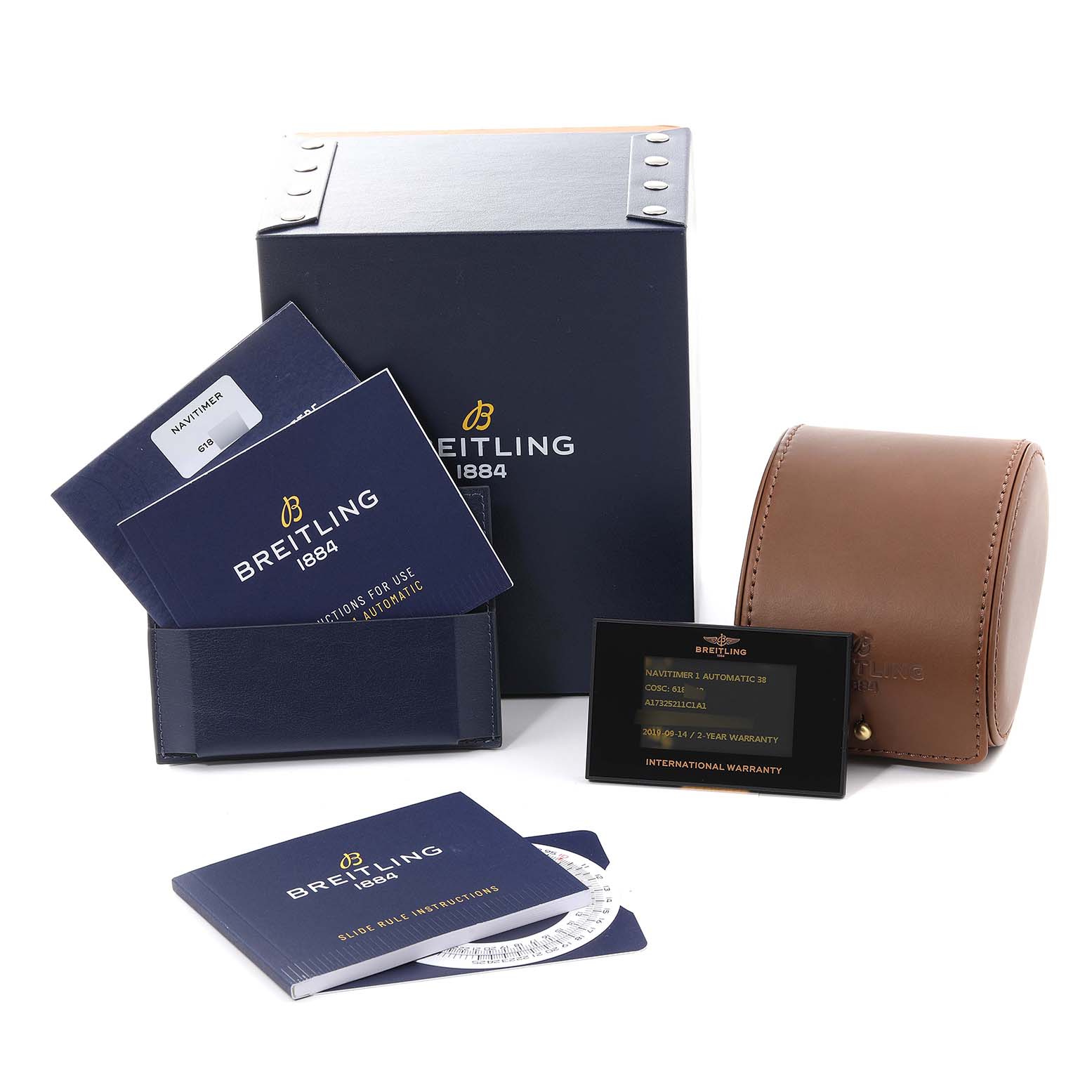 The image shows the packaging, manuals, warranty card, and leather case for a Breitling Navitimer A17325211C1A1 Men's Stainless Steel Blue Dial A17325211C1A1 Men's Stainless Steel Blue Dial watch.