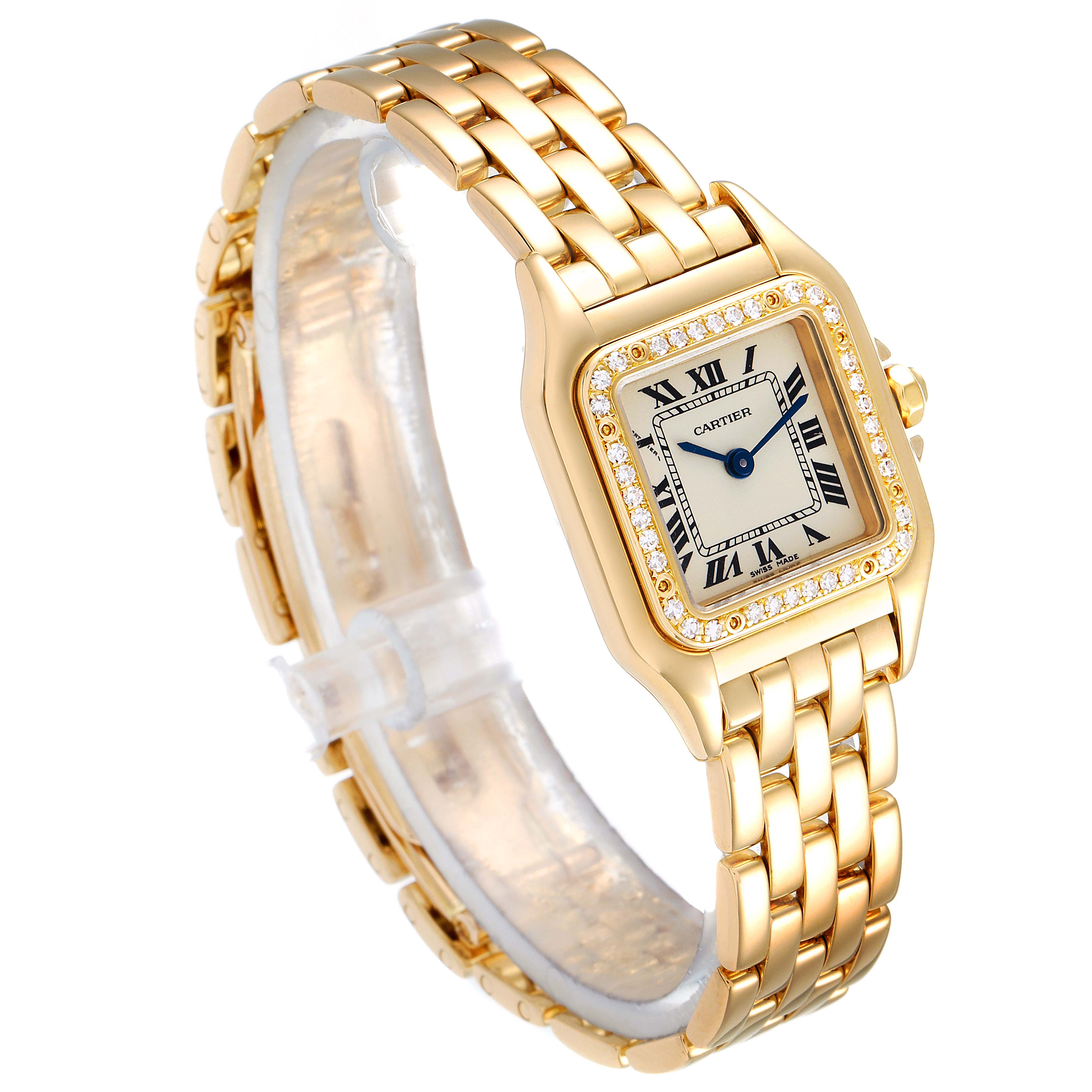 The Panthere model by Cartier is shown at a three-quarter angle displaying its gold bracelet and diamond-studded bezel.