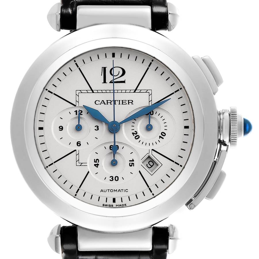 The Cartier Pasha watch is shown from the front, displaying the dial, subdials, and crown with its blue cabochon.