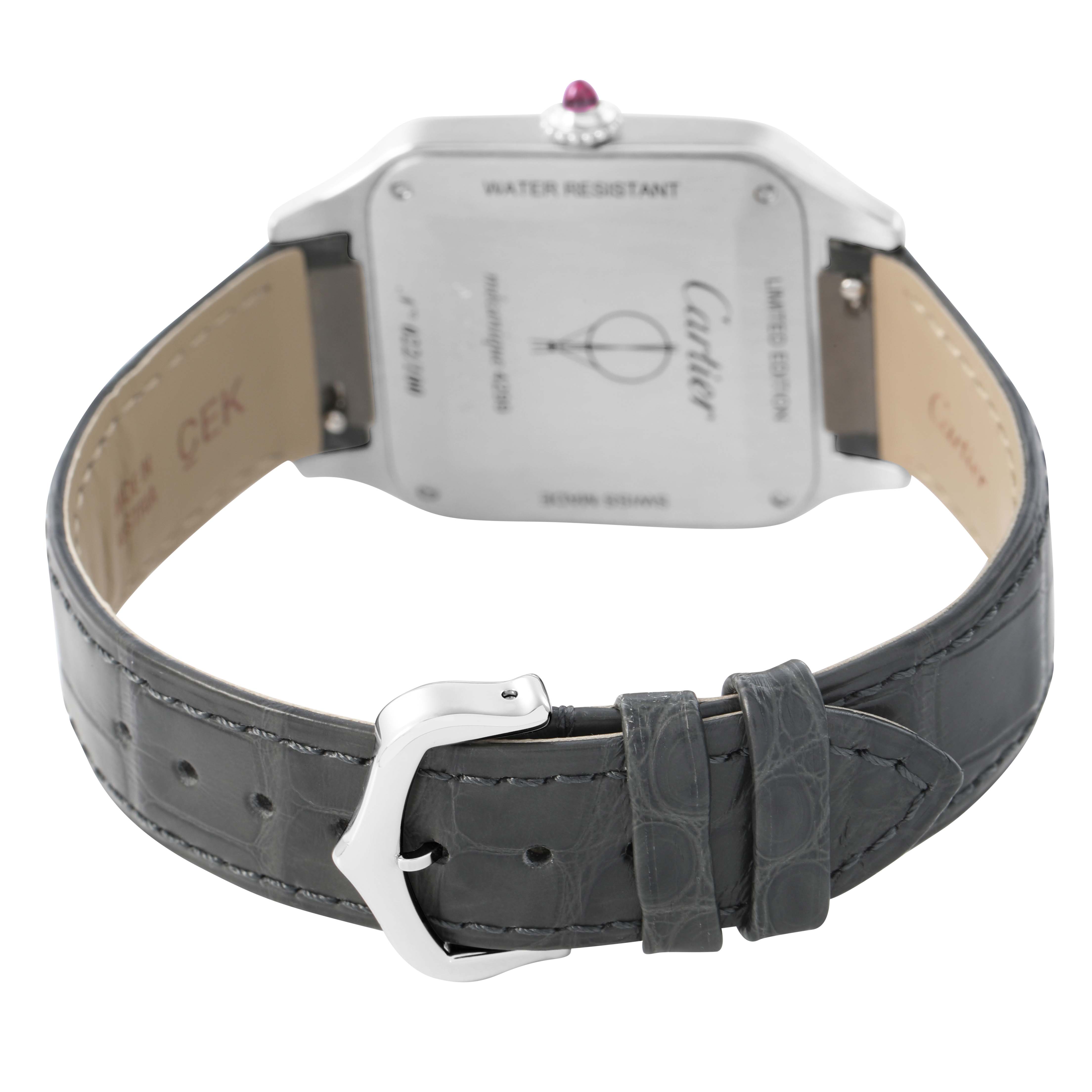 The image shows the back of a Cartier Santos Dumont WGSA0034 Men's Platinum Silver Dial watch, highlighting its case back, crown, and leather strap with a buckle.