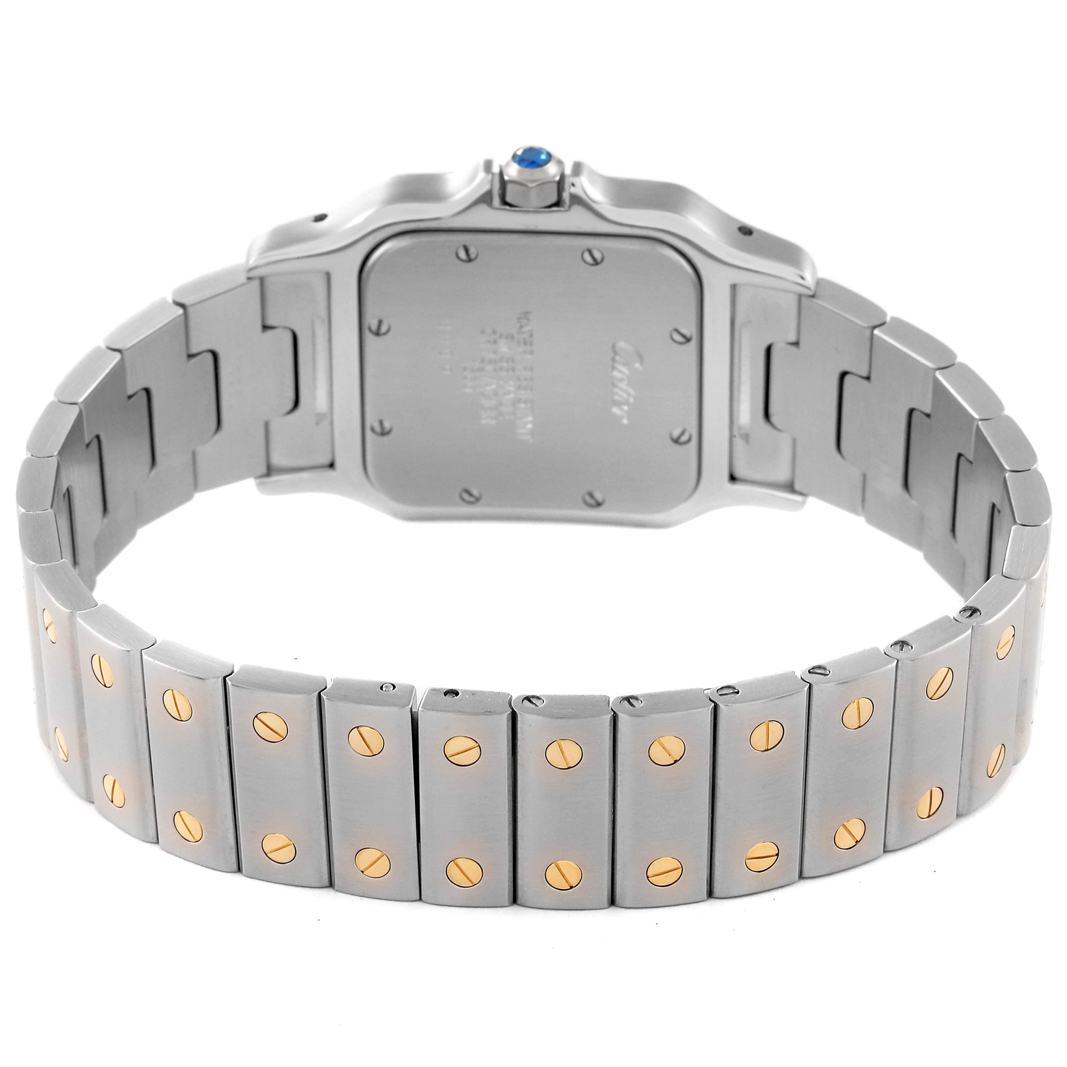 The image shows the back case and bracelet of the Cartier Santos W20011C4 Men
s Steel and Gold (two tone) Silver Dial W20011C4 Men
s Steel and Gold (two tone) Silver Dial watch, highlighting its metal links and gold screw accents.