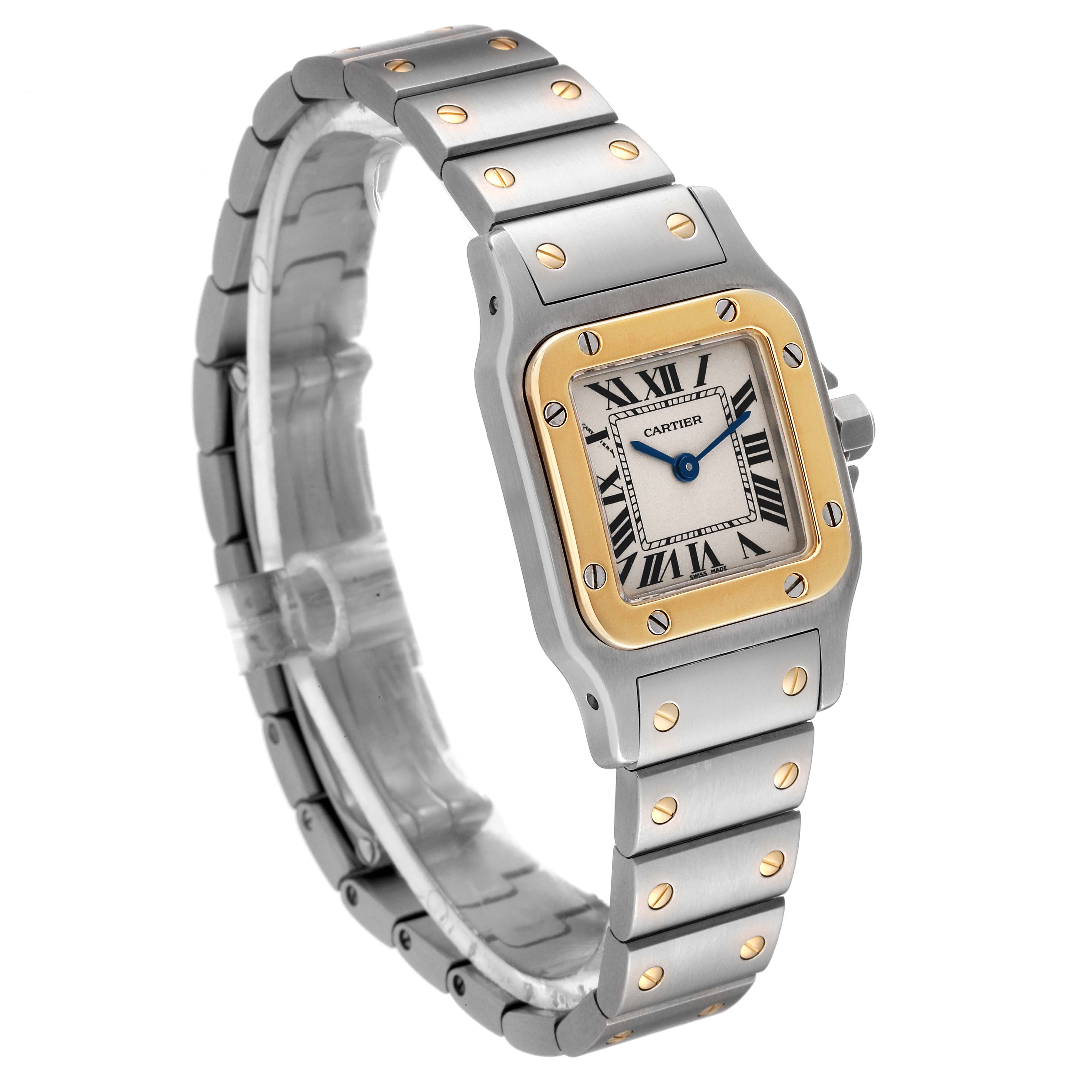 The Cartier Santos W20012C4 Women's Steel and Gold (two tone) Silver Dial W20012C4 Women's Steel and Gold (two tone) Silver Dial watch is shown at an angle highlighting its face, bezel, and bracelet with gold screws.