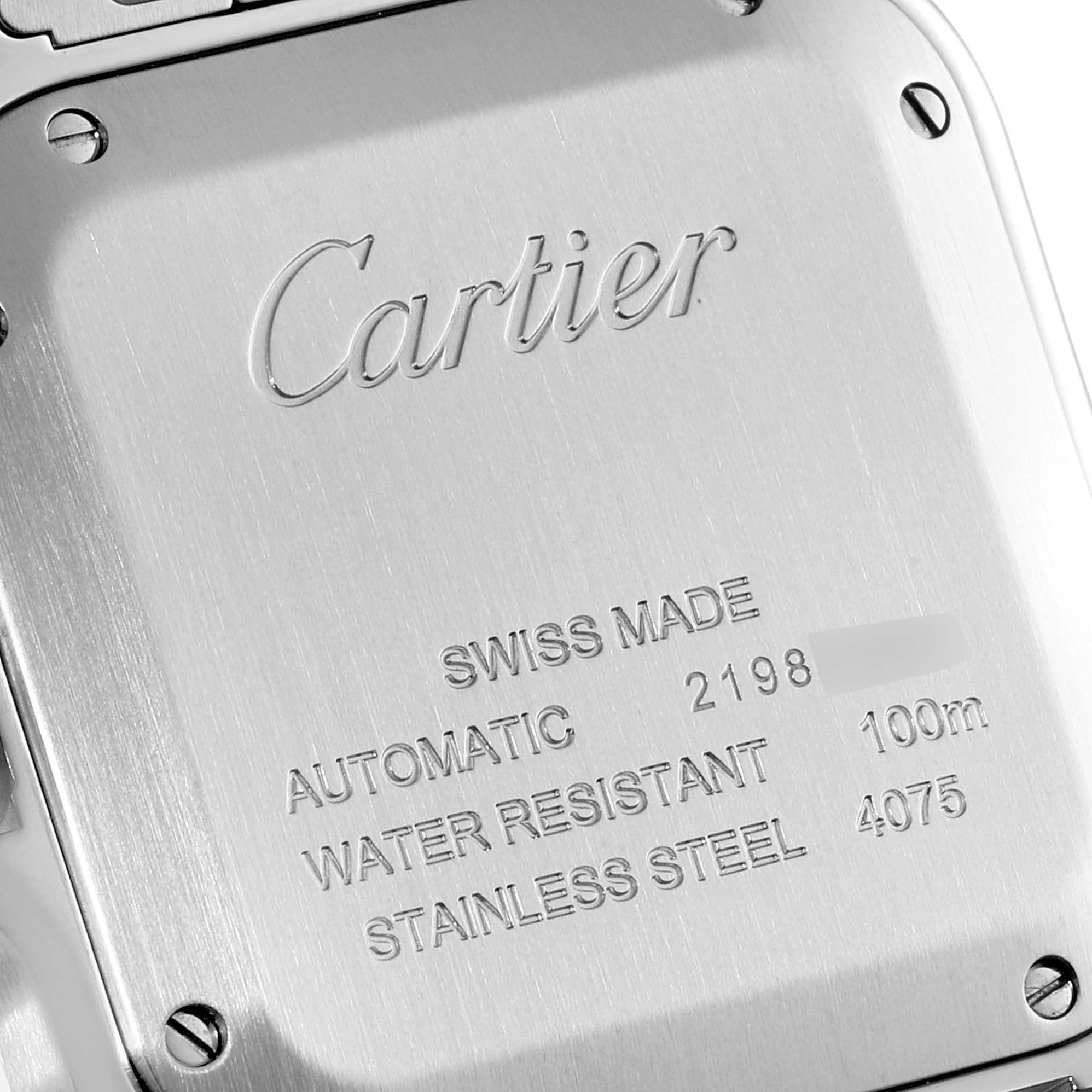 This image shows the back case of a Cartier Santos WSSA0029 Men's Stainless Steel Silver Dial WSSA0029 Men's Stainless Steel Silver Dial watch, displaying the engraved details and specifications.