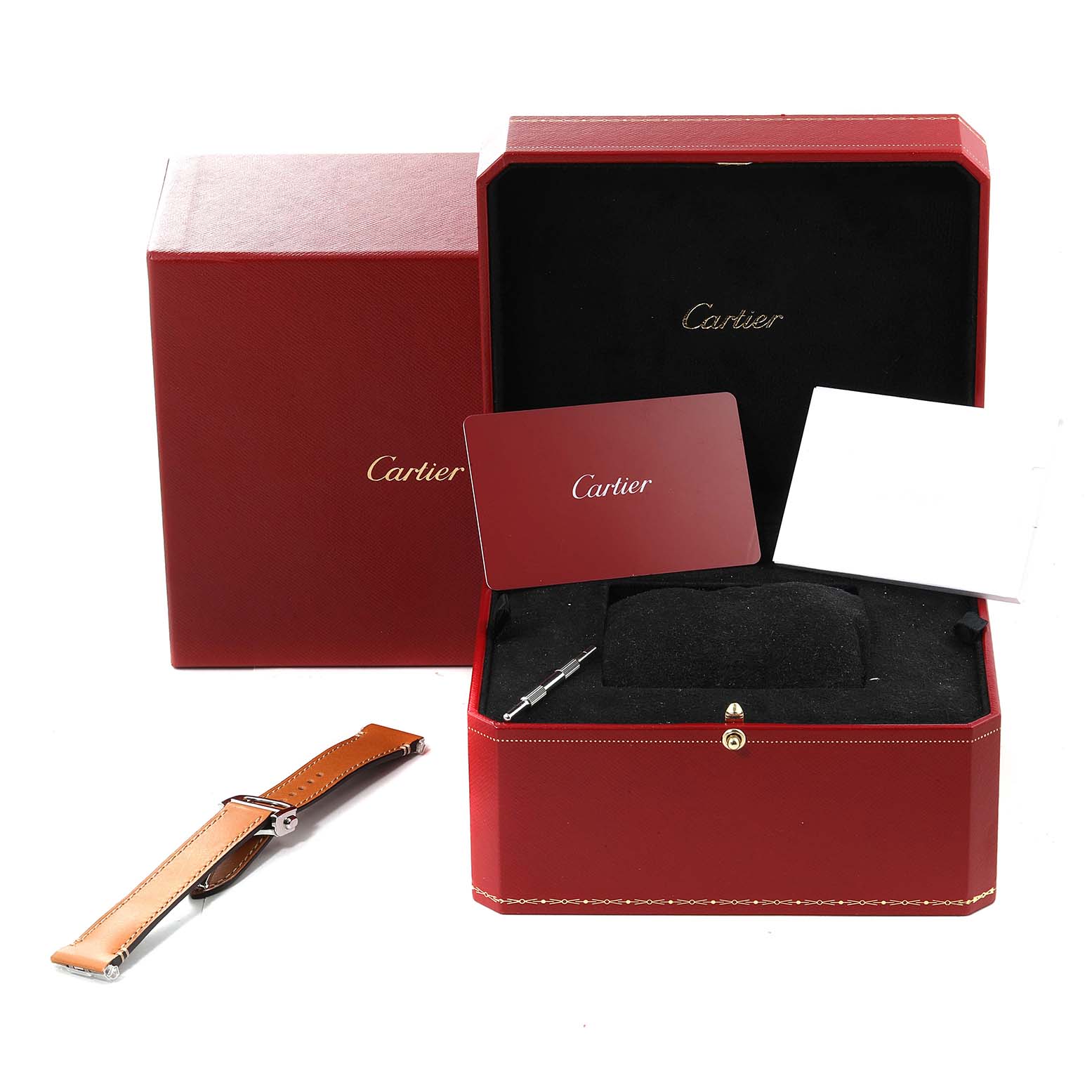 The image shows the Cartier Santos WSSA0029 Men's Stainless Steel Silver Dial WSSA0029 Men's Stainless Steel Silver Dial watch box with documentation, a spare watch strap, and a small tool.