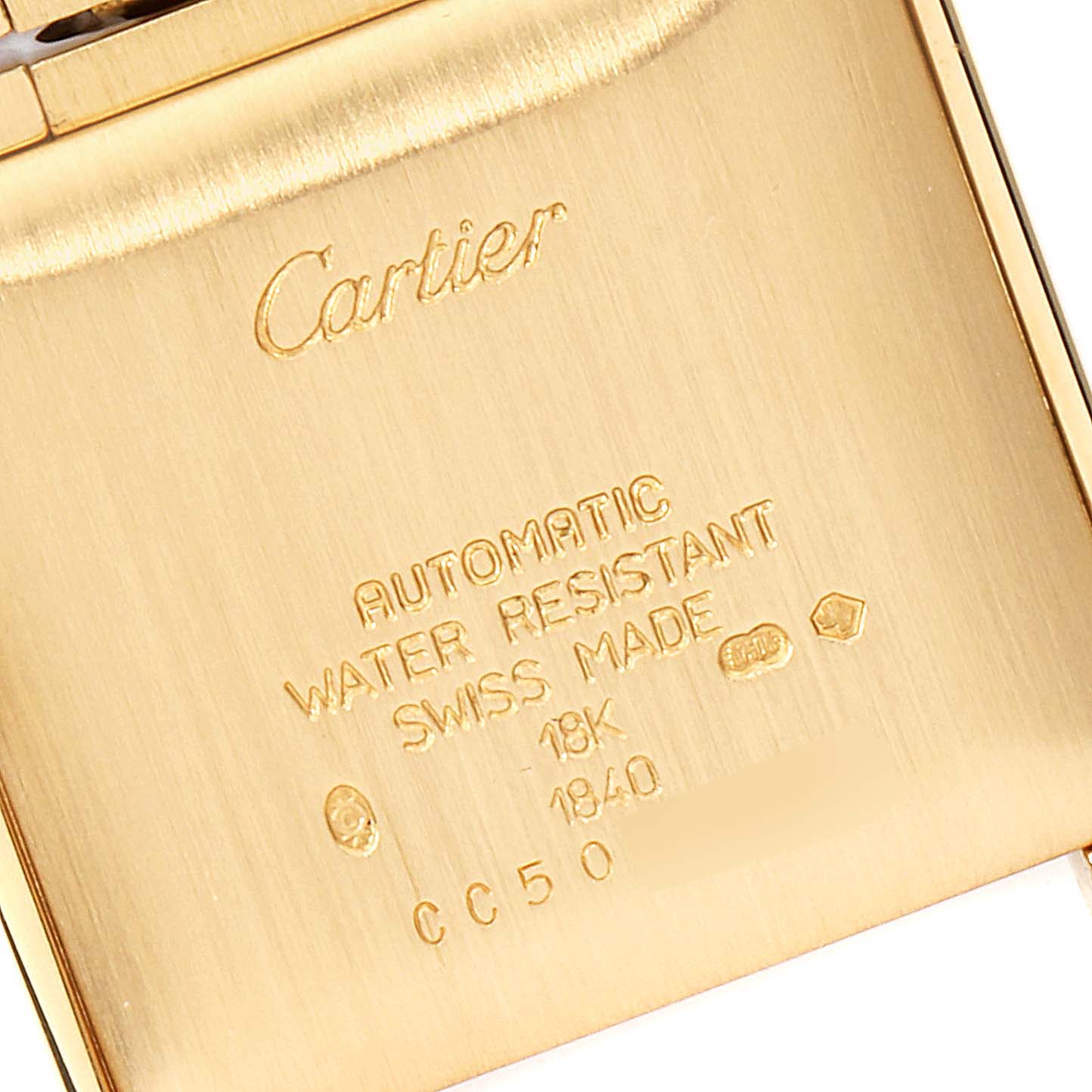The image shows the back case of a Cartier Tank Francaise W50001R2 Men's Yellow Gold Silver Dial W50001R2 Men's Yellow Gold Silver Dial watch with engraving details.