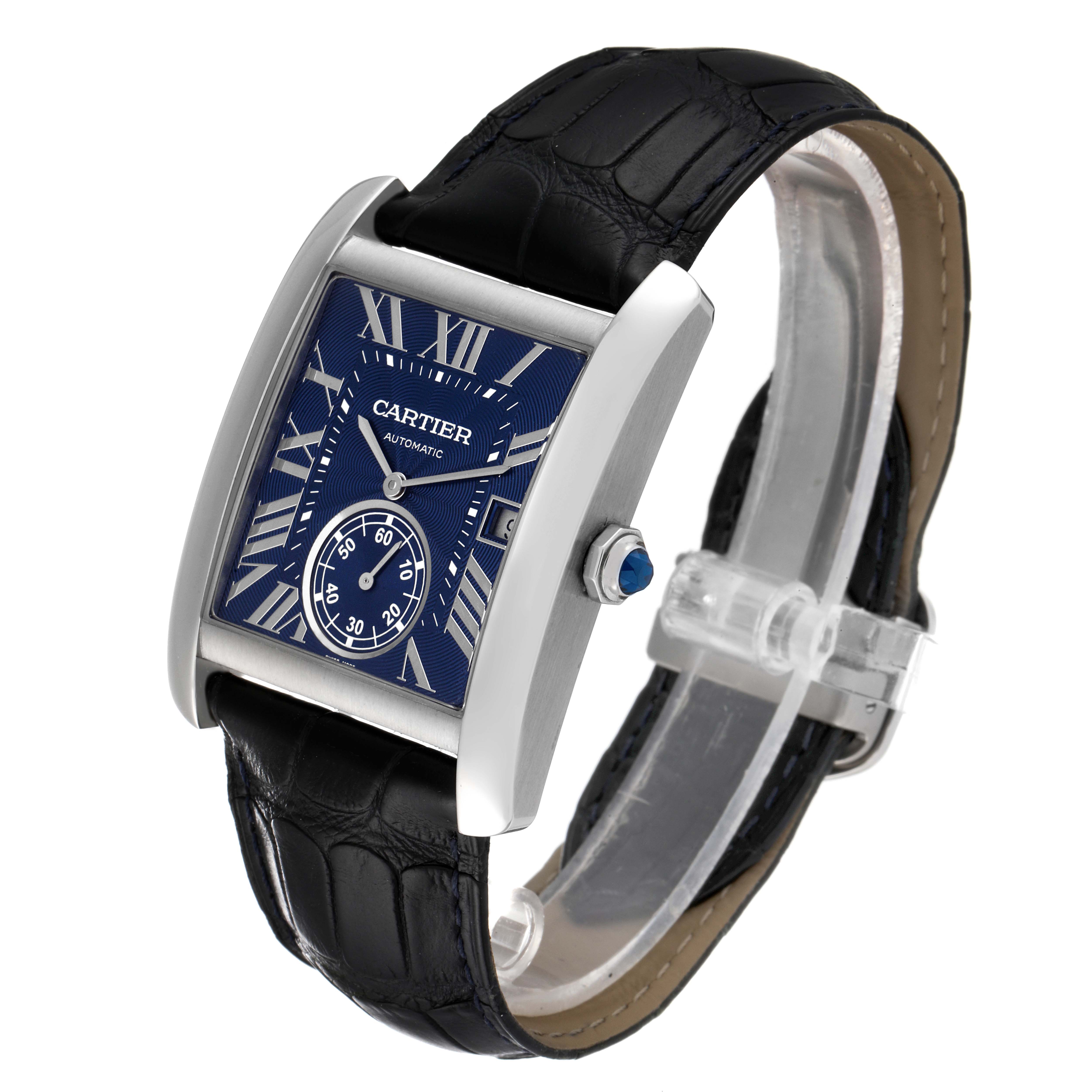 The image shows a Cartier Tank MC WSTA0010 Men
s Stainless Steel Blue Dial WSTA0010 Men
s Stainless Steel Blue Dial watch at a three-quarter angle, displaying its blue dial, Roman numerals, and black leather strap.