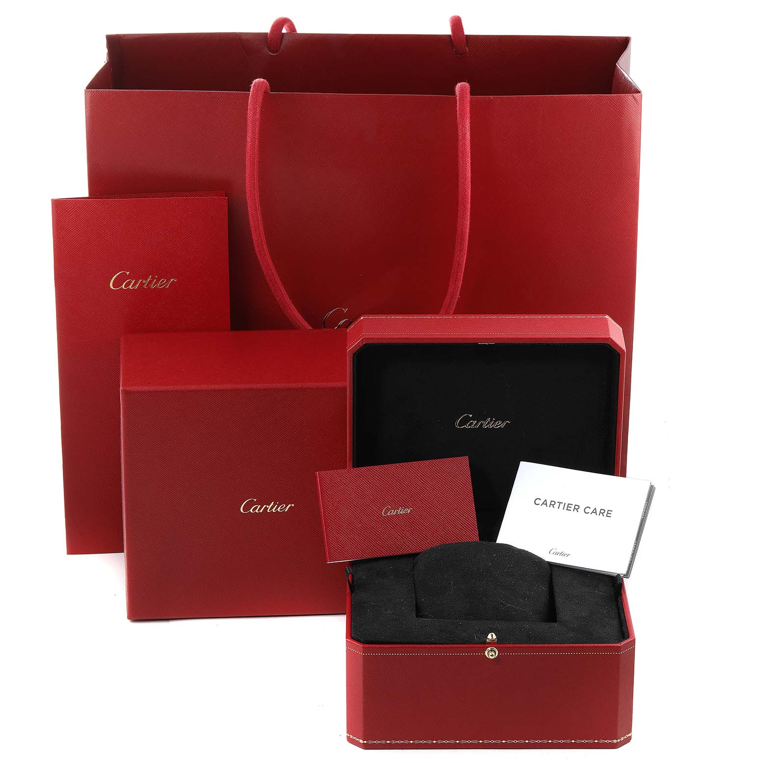 The image shows a Cartier Tank Must WSTA0053 Men's Stainless Steel Silver Dial WSTA0053 Men's Stainless Steel Silver Dial watch package, including a gift bag, box, and care booklets.