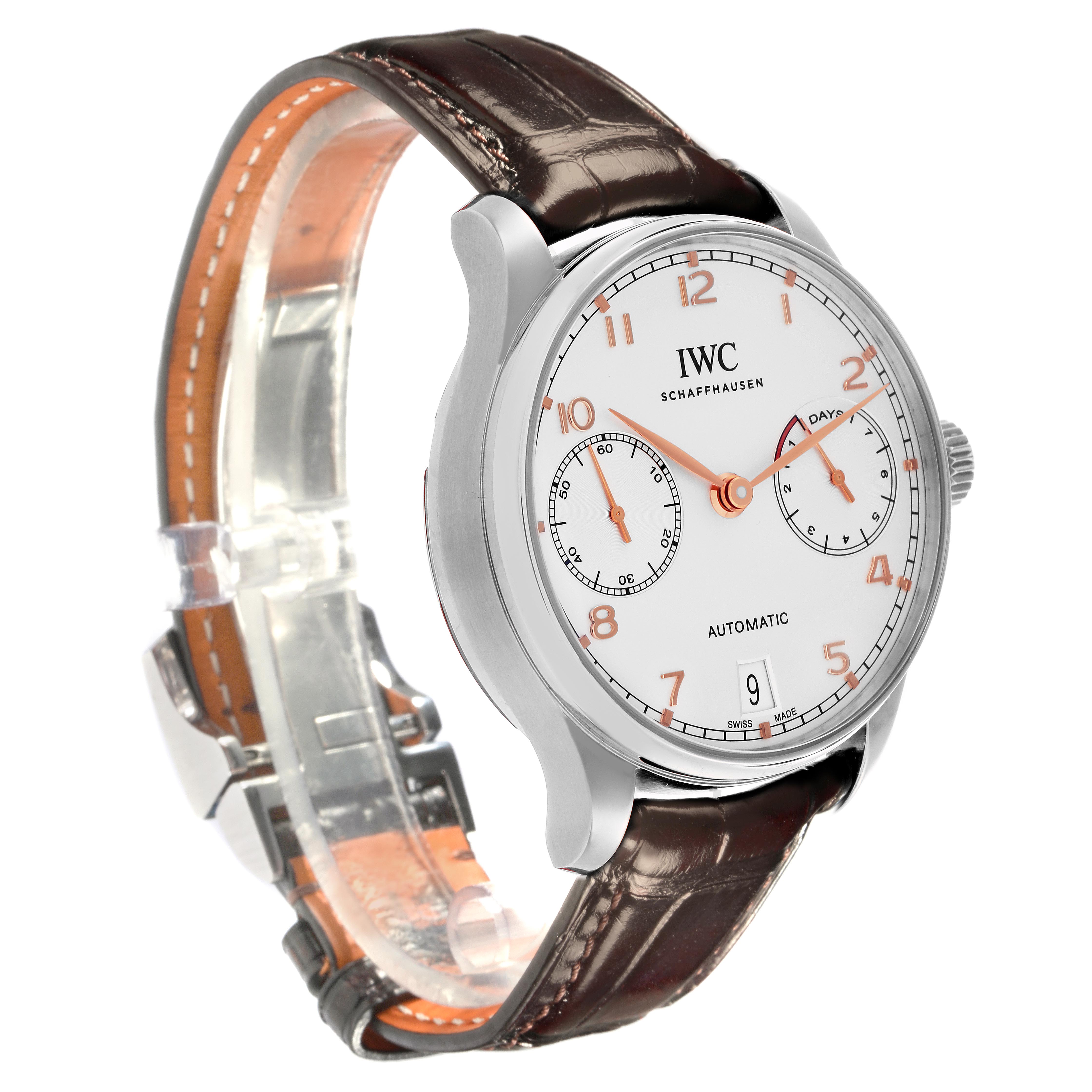 The IWC Portuguese IW500704 Men's Stainless Steel Silver Dial IW500704 Men's Stainless Steel Silver Dial watch is shown at a three-quarter angle, displaying its face, crown, and brown leather strap.