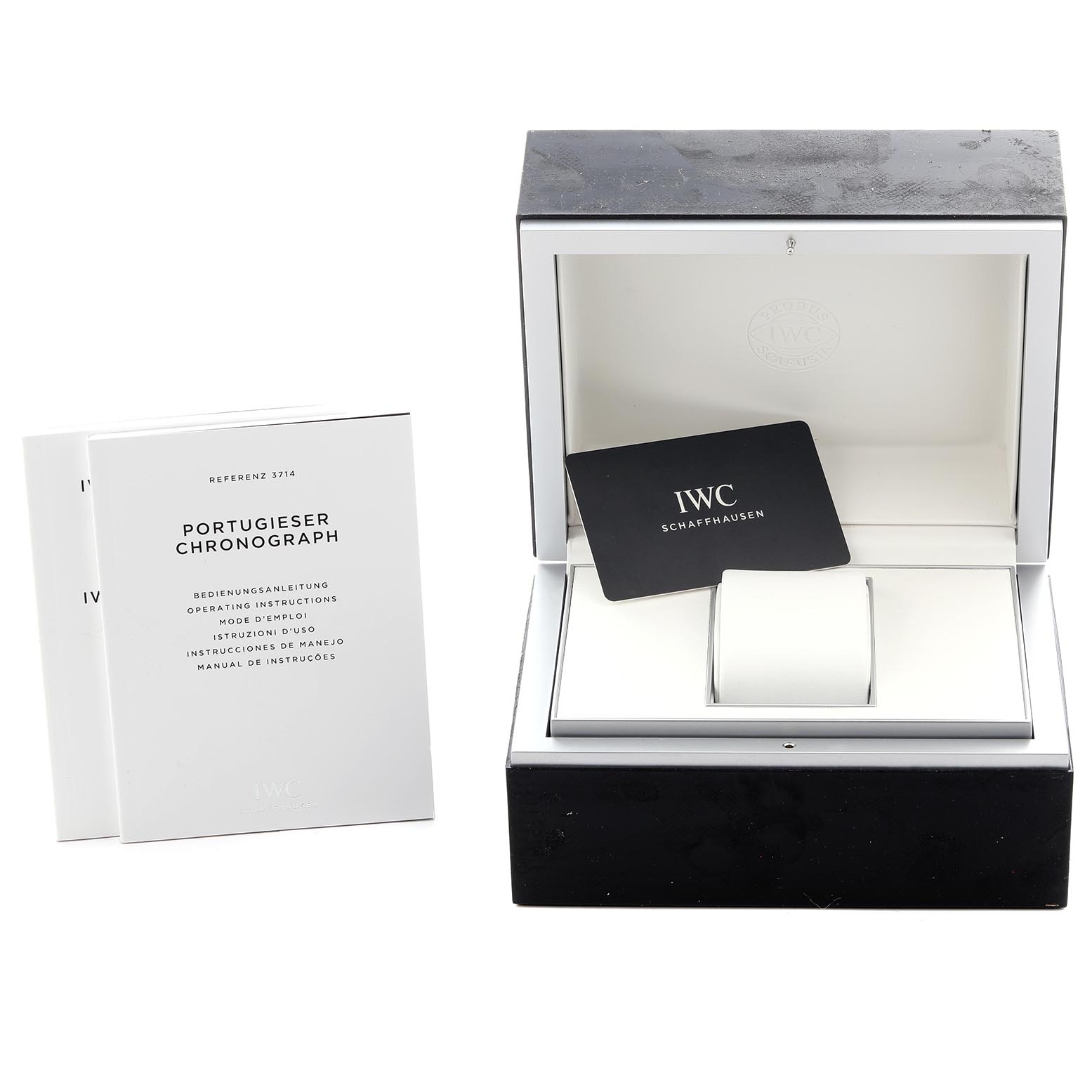 The image shows the IWC Portuguese IW371446 Men's Stainless Steel Silver Dial IW371446 Men's Stainless Steel Silver Dial watch box, instruction booklet, and warranty card from a front angle.