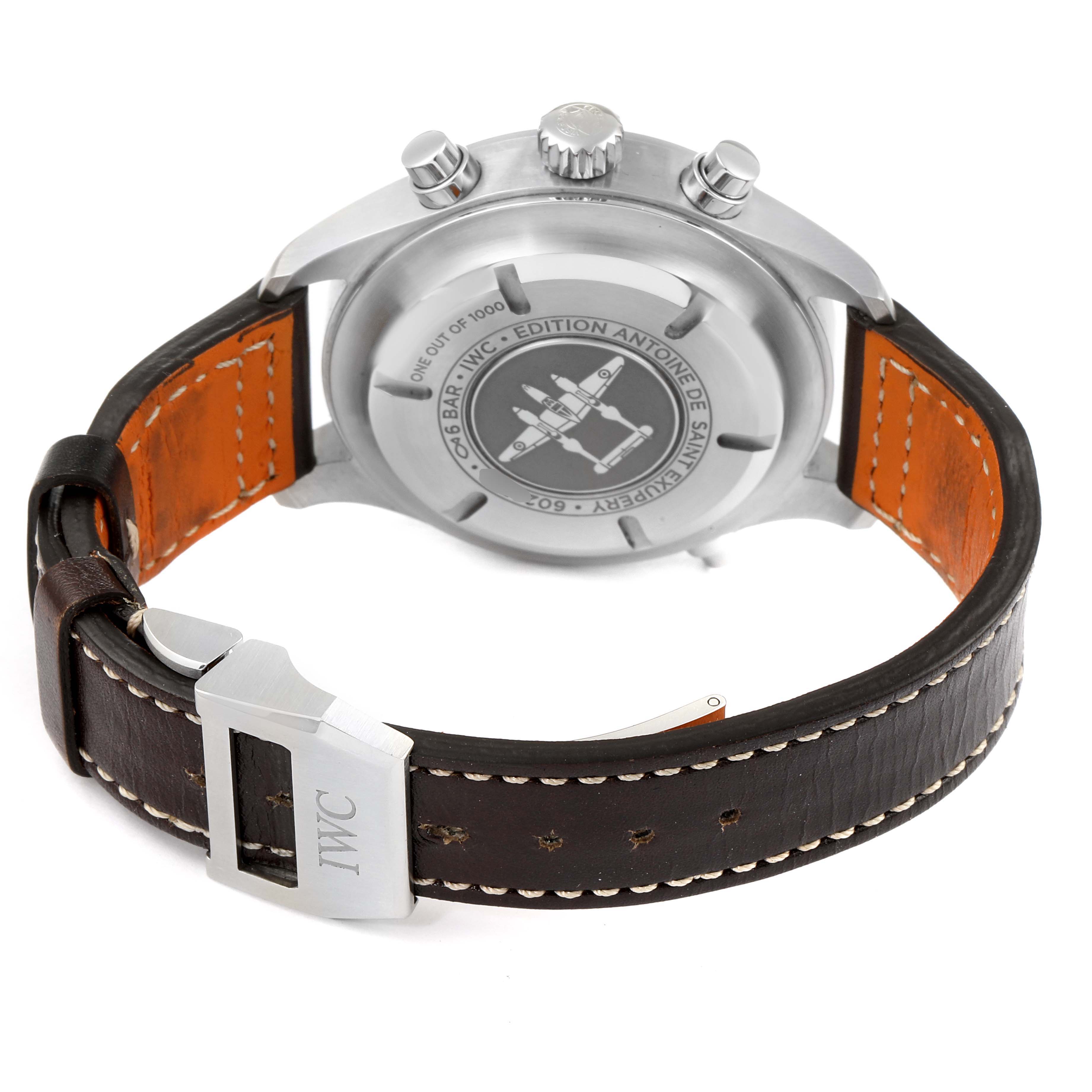 The image shows the back case and leather strap of the IWC Pilot IW371808 Men's Stainless Steel Brown Dial IW371808 Men's Stainless Steel Brown Dial model watch with Edition Antoine de Saint Exupery engravings.