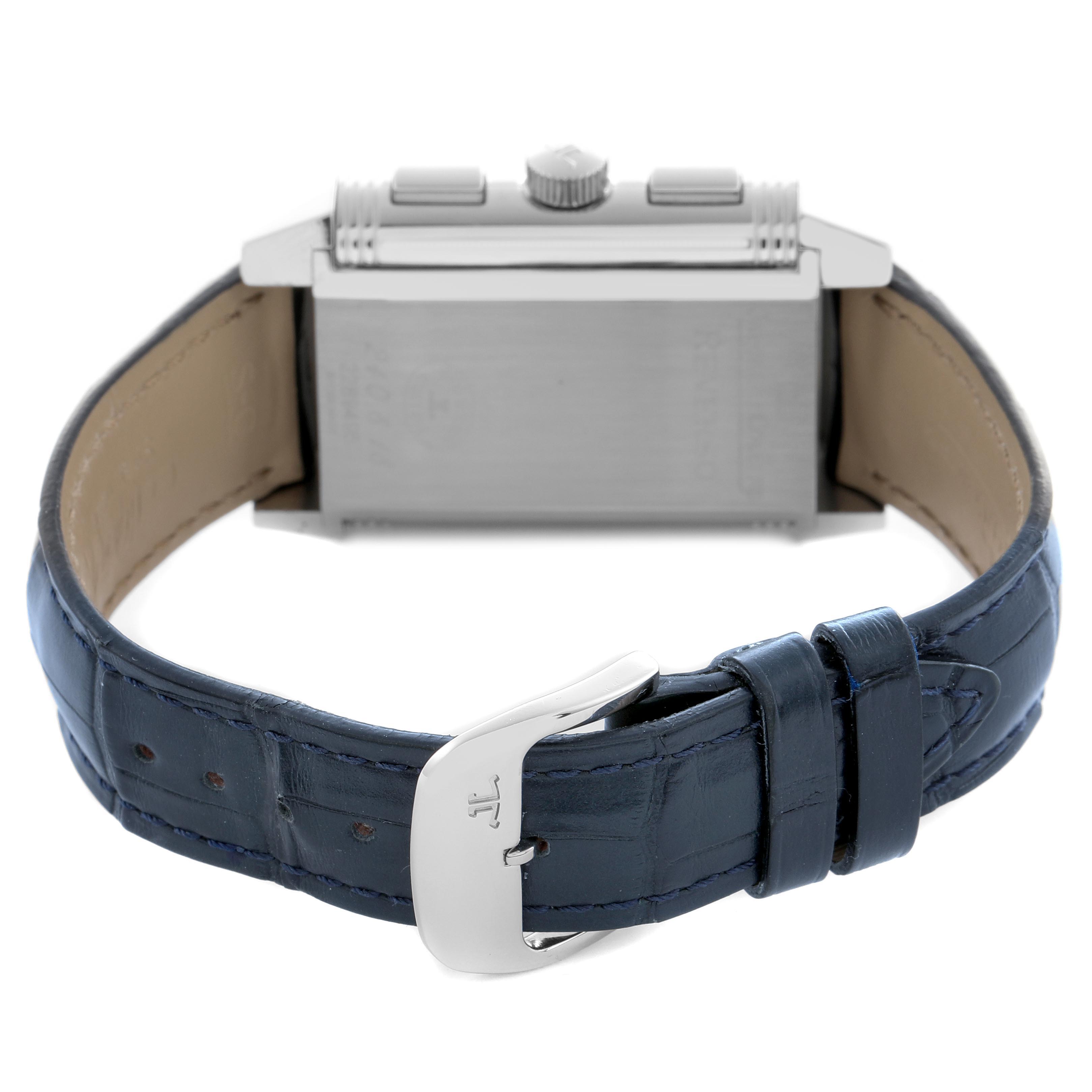 The Jaeger-LeCoultre Reverso watch is shown from the back, highlighting the strap and clasp, with a partial view of the case.