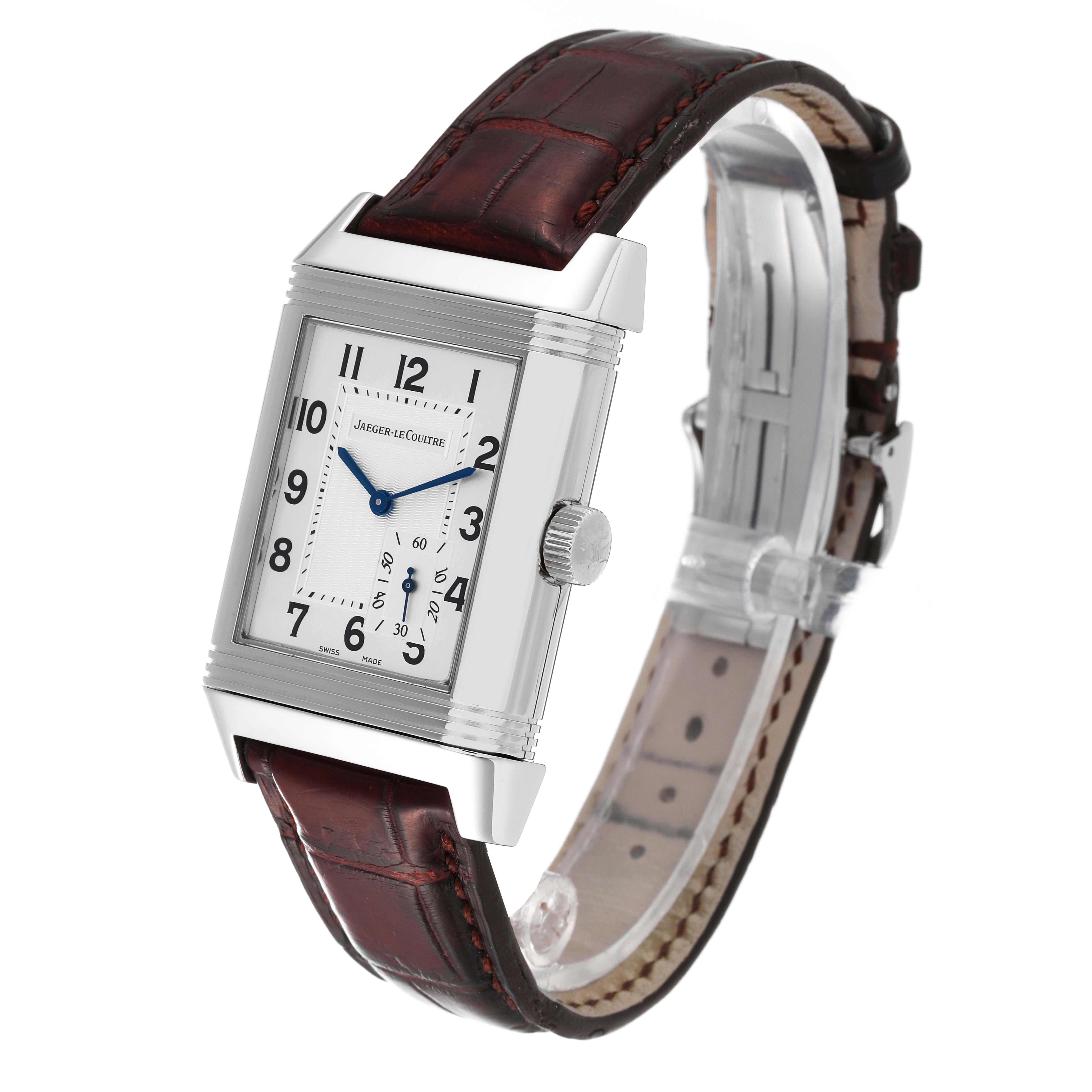 The Jaeger-LeCoultre Reverso watch is shown from a front-angle view, highlighting the dial and leather strap.