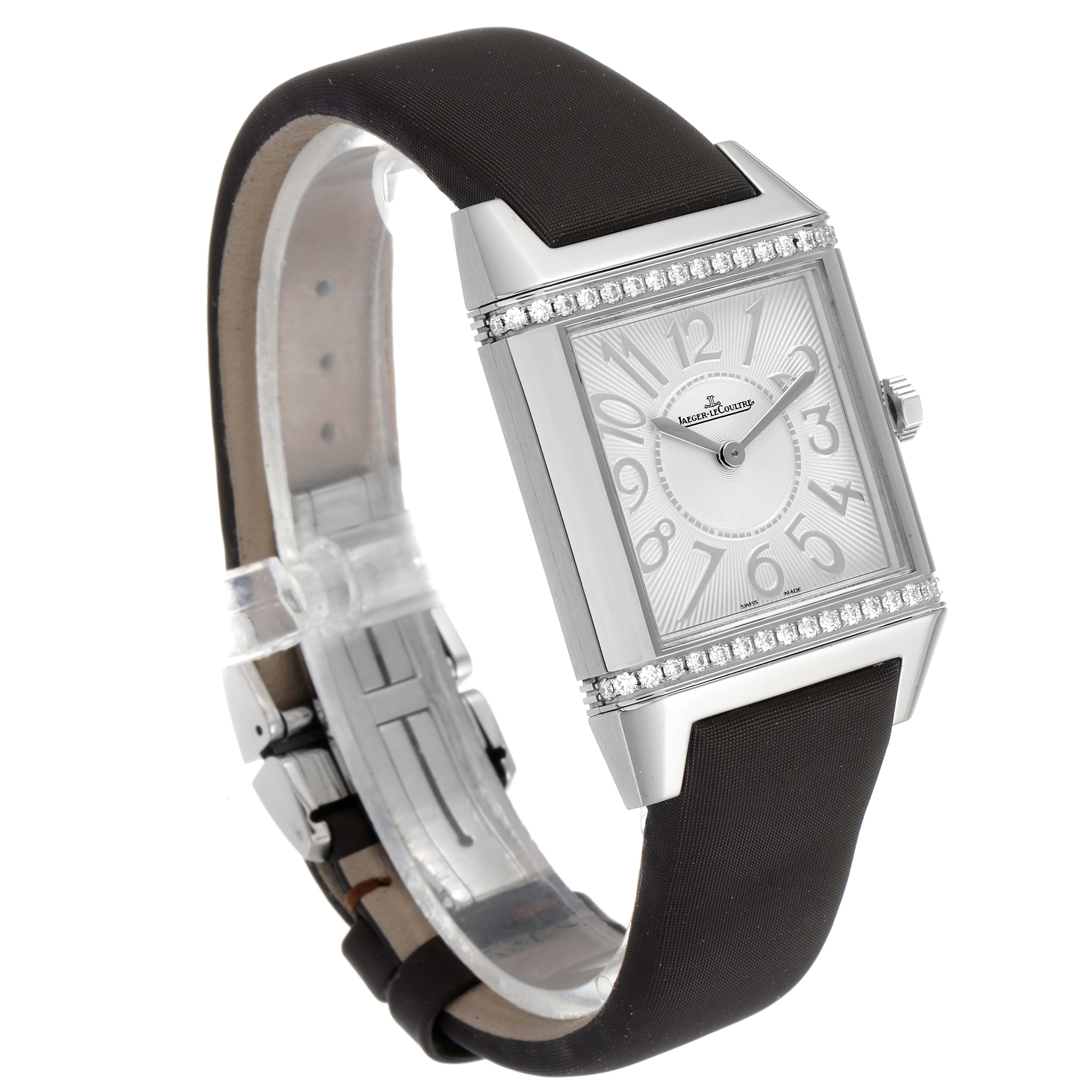 The image shows a Jaeger LeCoultre Reverso Q7038420 Women's Stainless Steel Silver Dial Q7038420 Women's Stainless Steel Silver Dial watch angled slightly to the right, displaying its rectangular face and black strap.