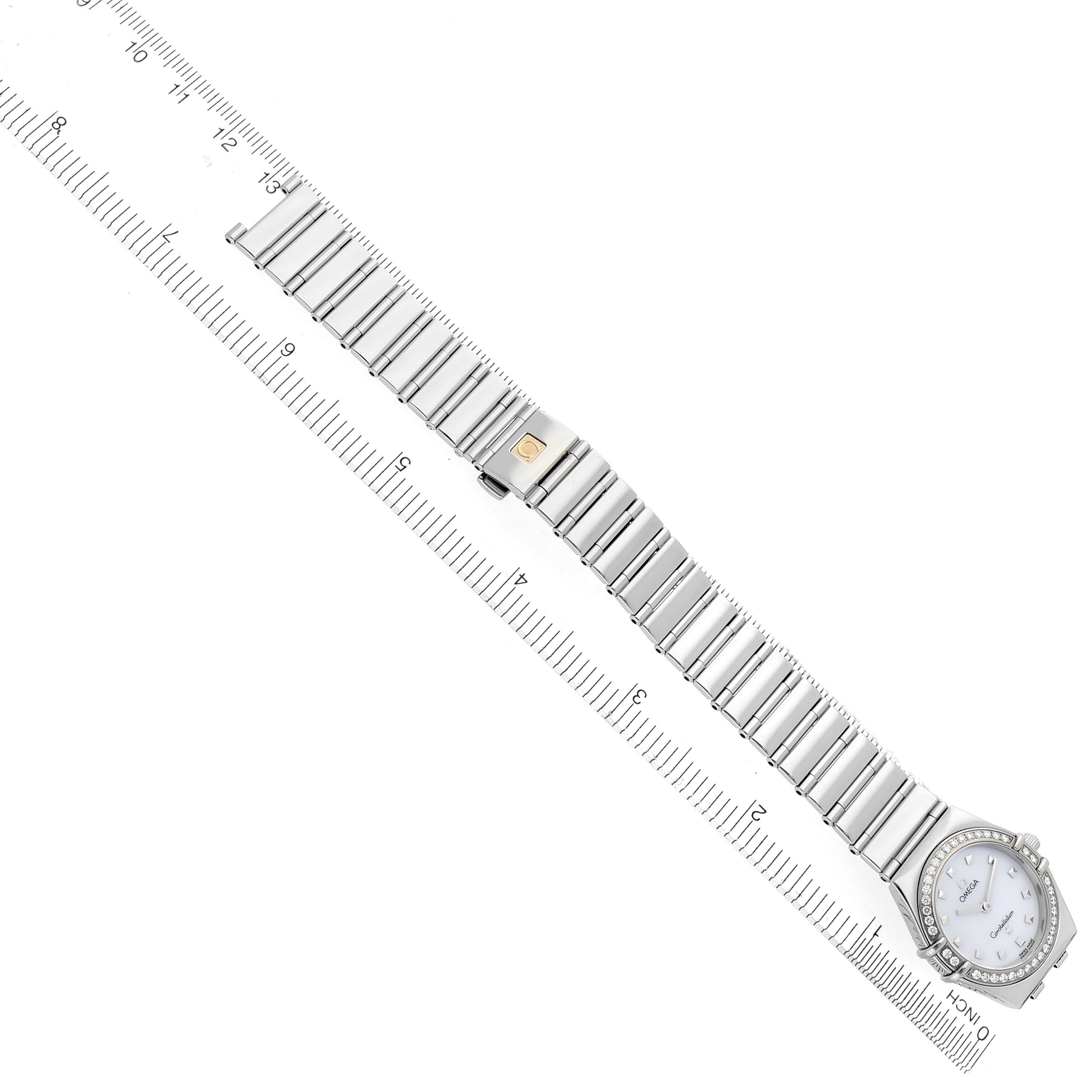 The Omega 1475.71.00 Women's Stainless Steel Mother of Pearl Dial 1475.71.00 Women's Stainless Steel Mother of Pearl Dial Constellation My Choice watch is shown from a top view, highlighting its full bracelet alongside a ruler for scale.