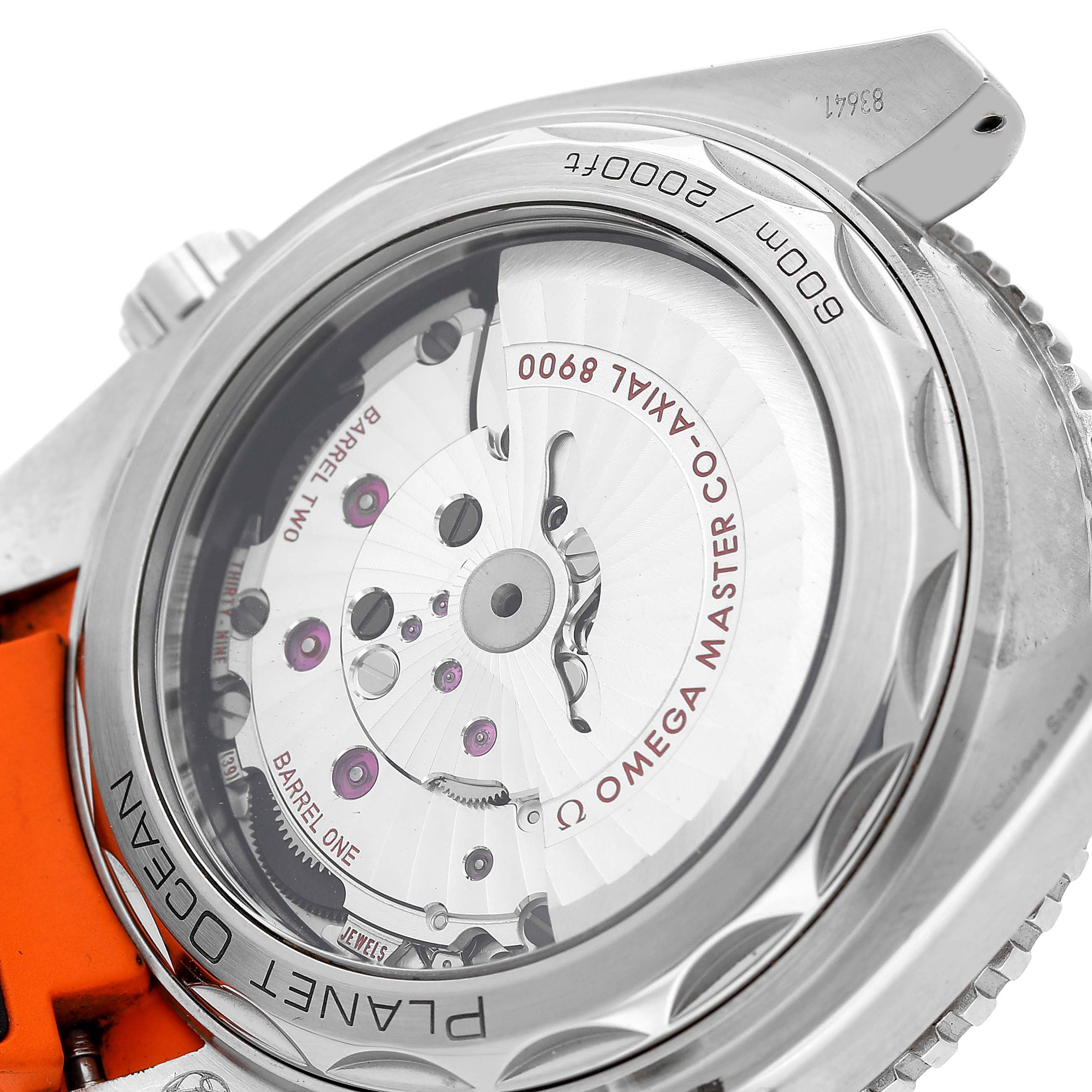 The Omega Planet Ocean 215.32.44.21.01.001 Men's Stainless Steel Black Dial watch is shown from the back, highlighting its exposed movement and detailed engravings.