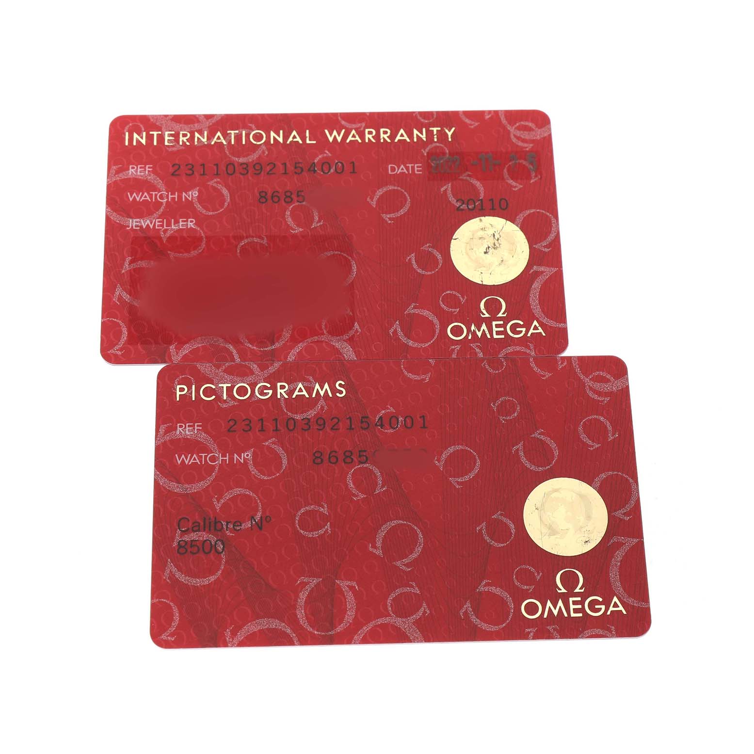 These are warranty and pictogram cards for the Omega Aqua Terra 231.10.39.21.54.001 Men's Stainless Steel White Dial watch, shown from a top-down angle.