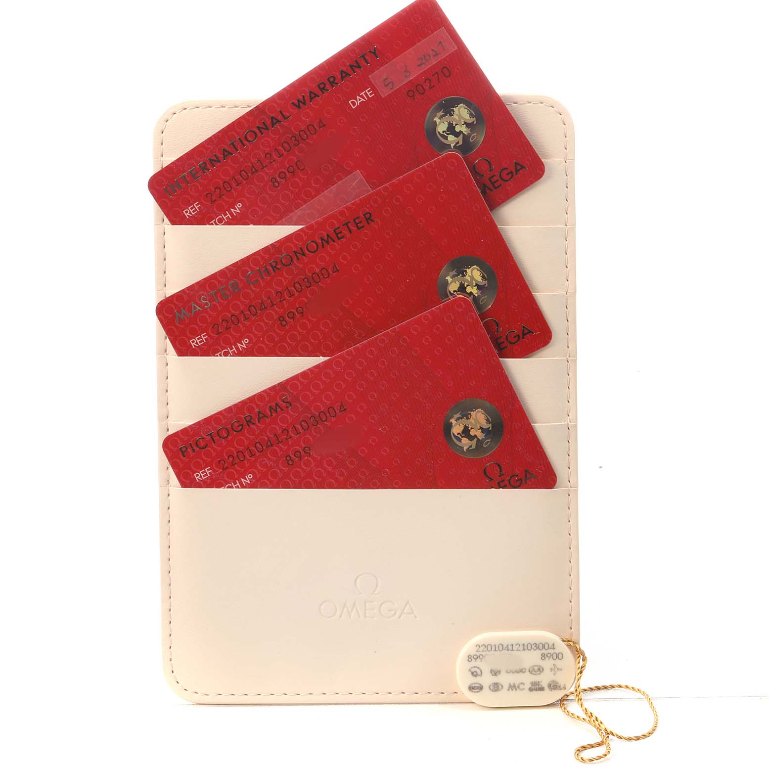 The image shows red warranty and certification cards in a beige Omega holder for the Aqua Terra model.